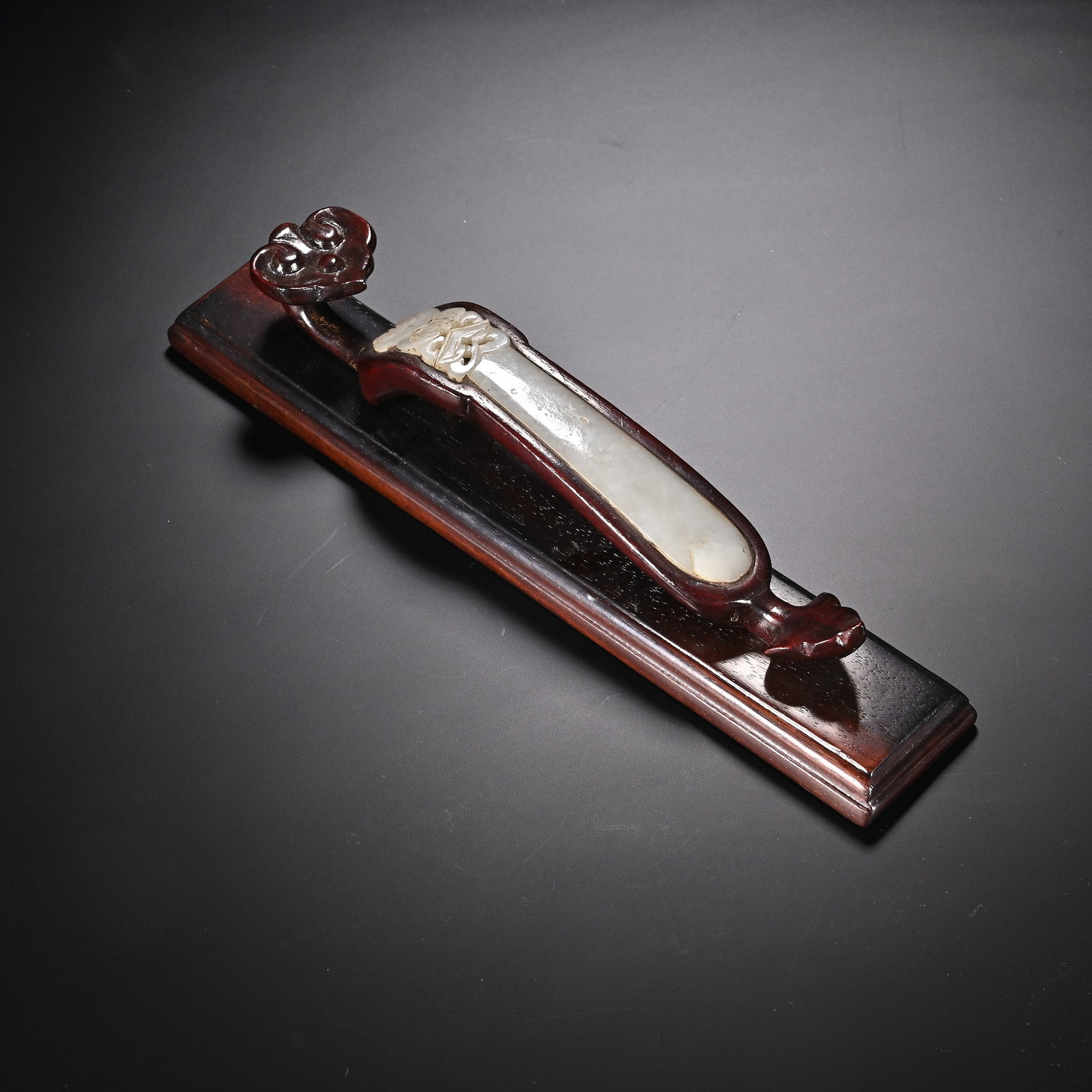 A Chinese Hardwood Ruyi-Form Paperweight with Jade Inlay (1 of 8)