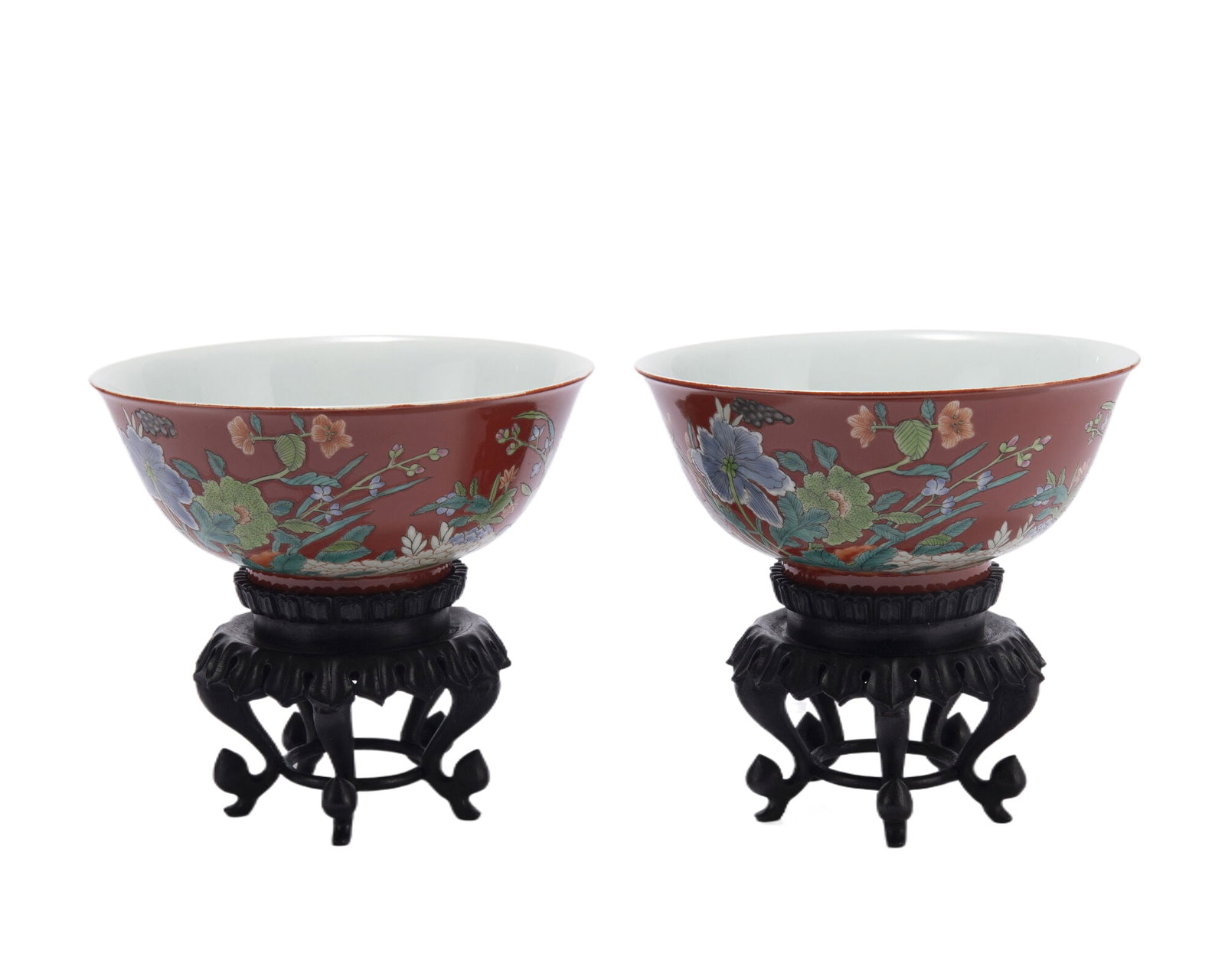 PAIR FAMILLE ROSE FLOWERS BOWLS: PAIR FAMILLE ROSE FLOWERS BOWLS The deep rounded sides rising from a straight foot to an everted rim, the exterior painted in garden scene, Qianlong mark, with fitted wooden stand. DIMENSIONS: Diam. 1