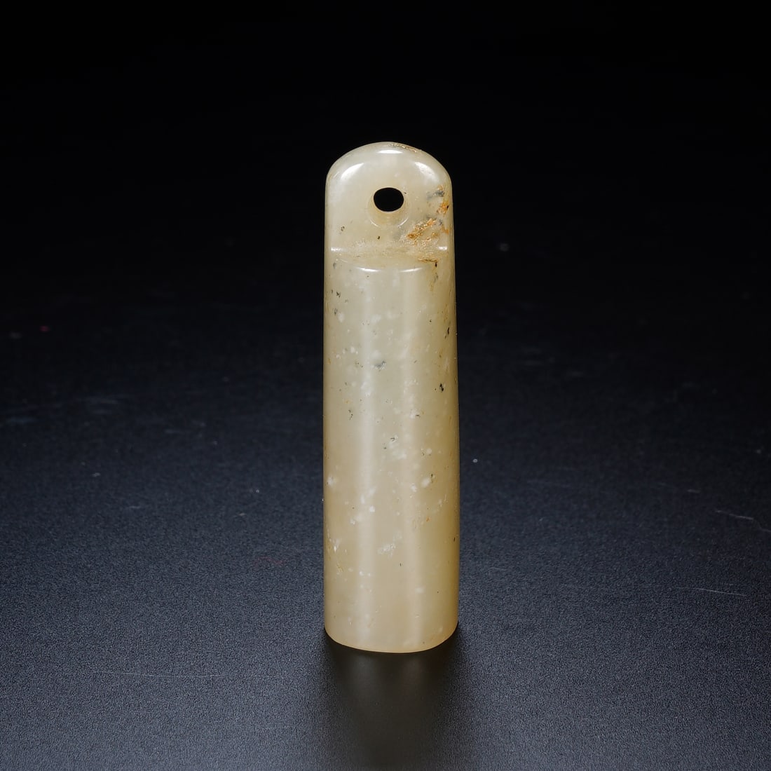 Chinese Hetian White Jade Pipe Mouthpiece: Chinese Hetian White Jade Pipe Mouthpiece This slender pipe mouthpiece is carved from a single piece of Hetian white jade, exhibiting a soft, creamy tone with natural speckled inclusions and subtle ru
