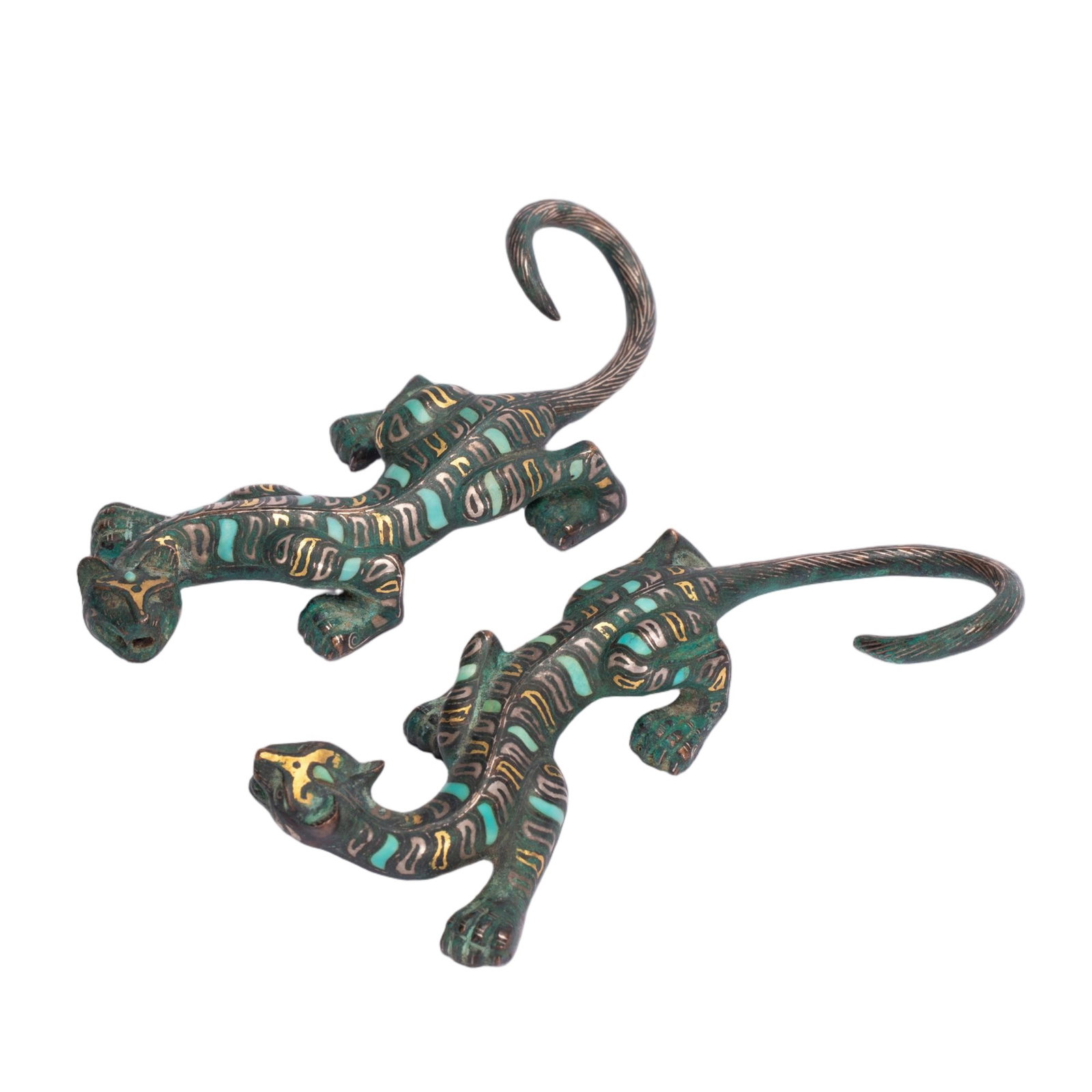 Pair of Chinese Gold and Silver Inlaid Turquoise Bronze Tigers: Pair of Chinese Gold and Silver Inlaid Turquoise Bronze Tigers A pair of archaic-style bronze tigers, cast in a dynamic, prowling pose with tails elegantly curled upward. Their bodies are exquisitely