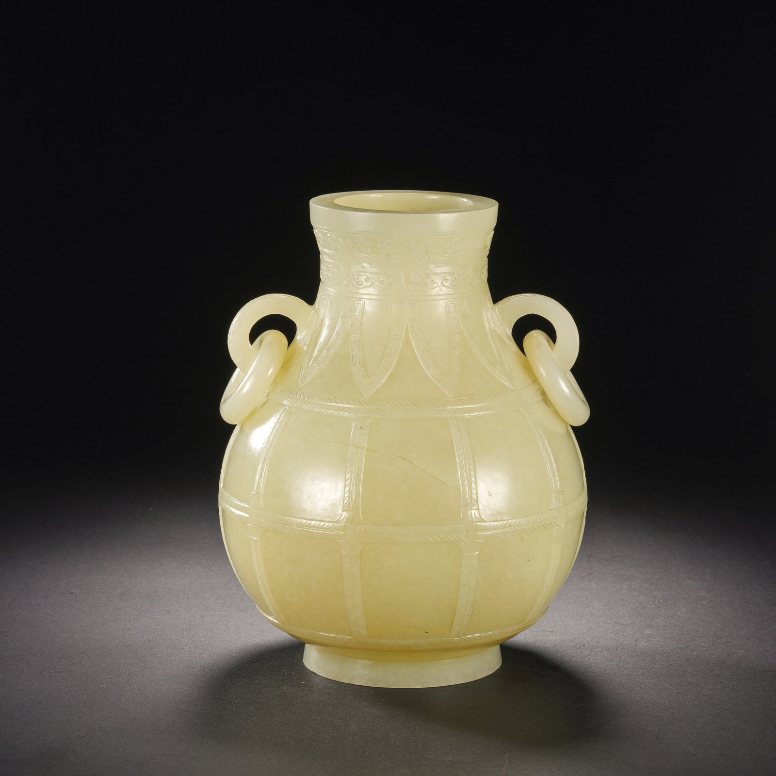 Chinese White Jade Vase with Loose Ring Handles: Chinese White Jade Vase with Loose Ring Handles This elegant vase is carved from a single piece of fine white jade, exhibiting a warm, even tone and smooth, lustrous finish. The bulbous body is