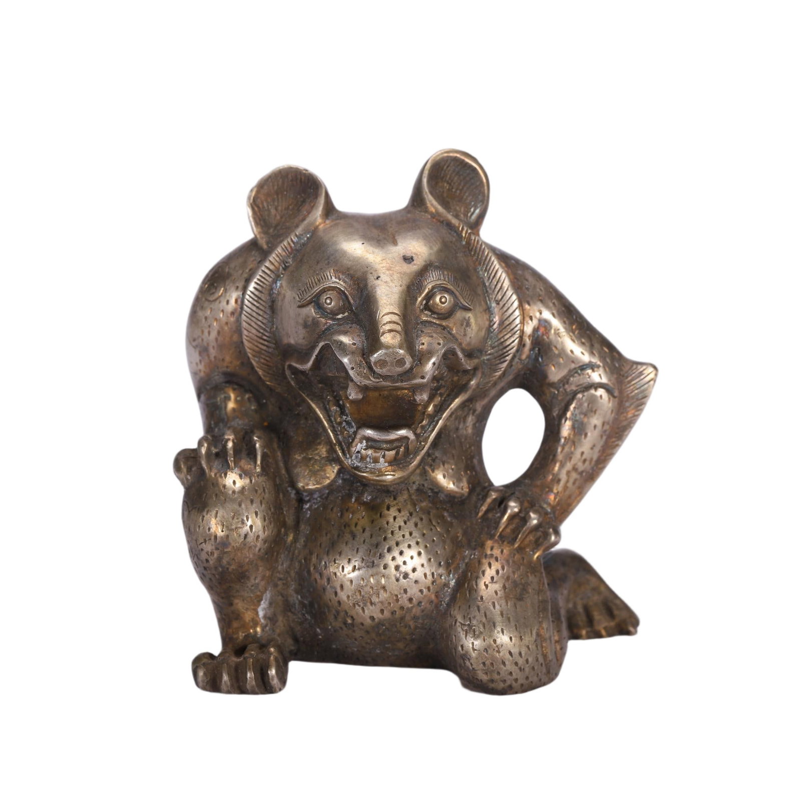 A Chinese Bronze Bear Ornament: A Chinese Bronze Bear Ornament This Chinese bronze bear ornament stands at 9 cm in height. Cast in the form of a stylized bear in a dynamic, crouched pose, the figure features an open mouth with bared