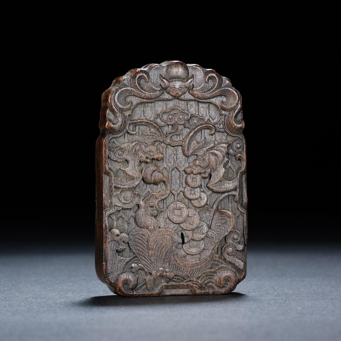 Chinese Agarwood "Fu and Shou" Plaque: Chinese Agarwood "Fu and Shou" Plaque This finely carved Chinese plaque is crafted from agarwood, featuring auspicious motifs of bats, coins, and a carp, all symbols of good fortune, longevity, and pr