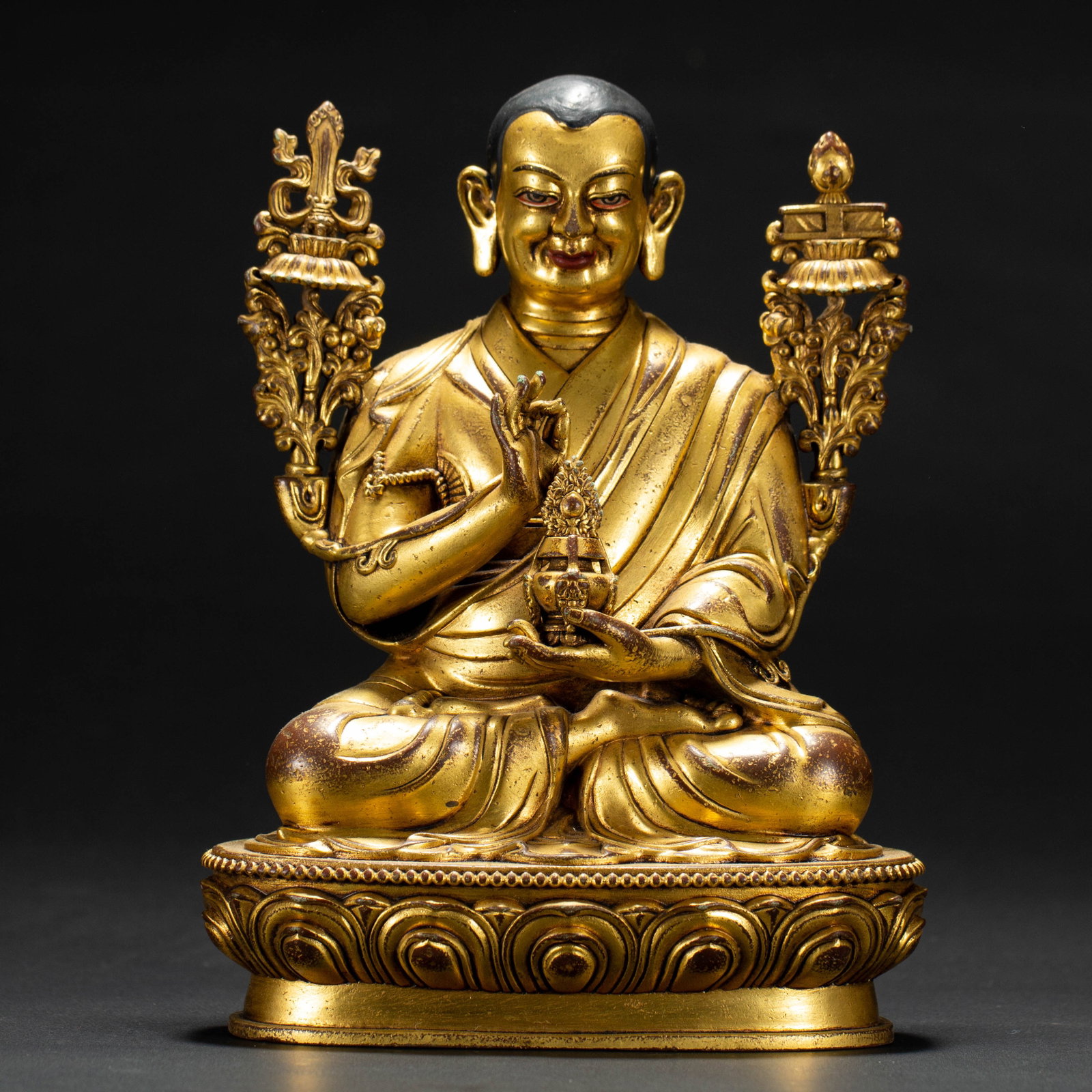 Chinese Gilt Copper Lama Statue: Chinese Gilt Copper Lama Statue A finely modelled Chinese gilt copper statue of a seated Buddhist lama, depicted in meditative pose on a detailed double lotus base. The figure wears flowing monastic r