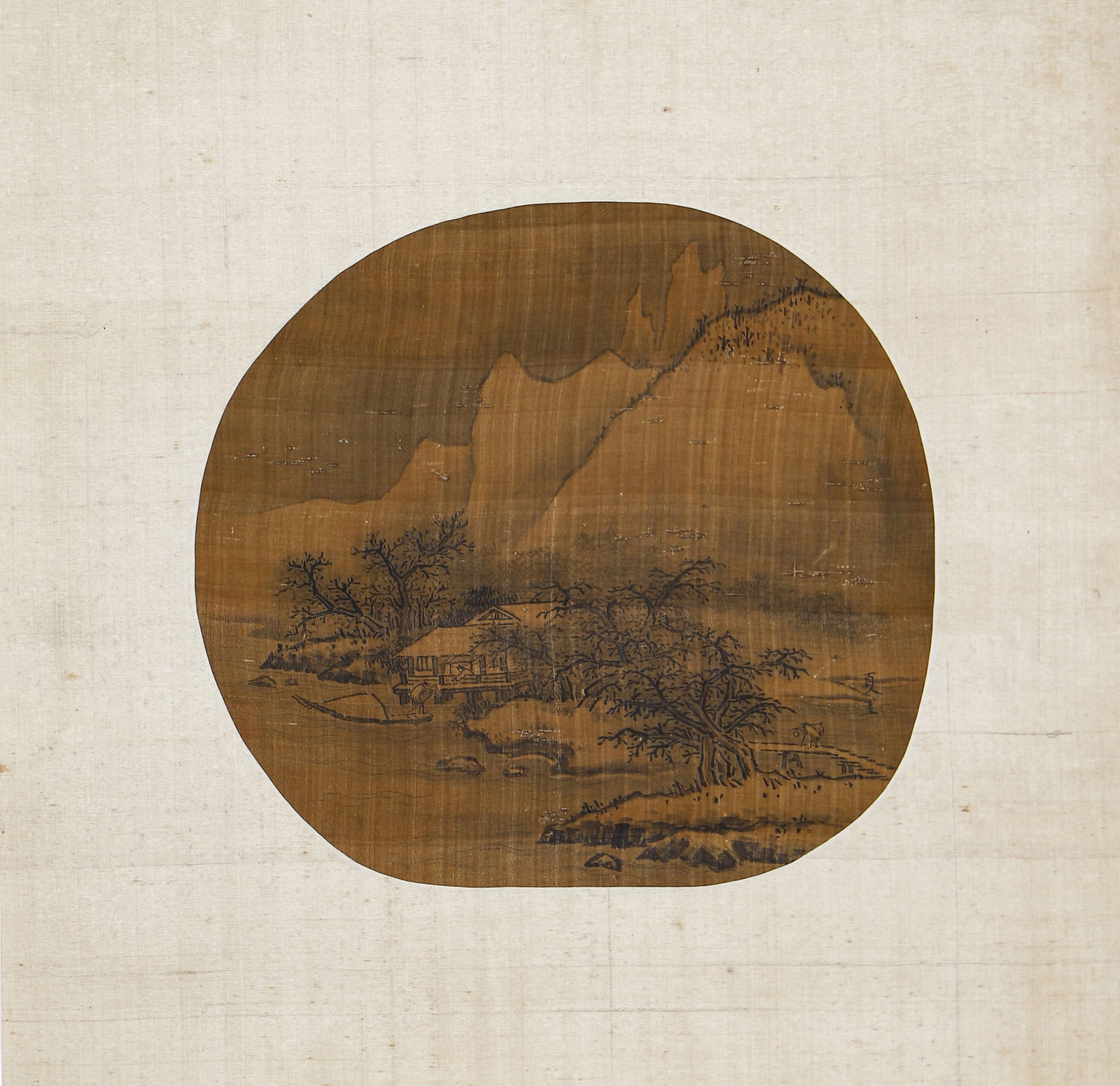 A CHINESE PAINTING OF LANDSCAPE: A CHINESE PAINTING OF LANDSCAPE This fine circular fan painting depicts a serene winter landscape with snow-capped mountains, a thatched cottage, bare trees, and a lone boat. Executed in ink on aged s