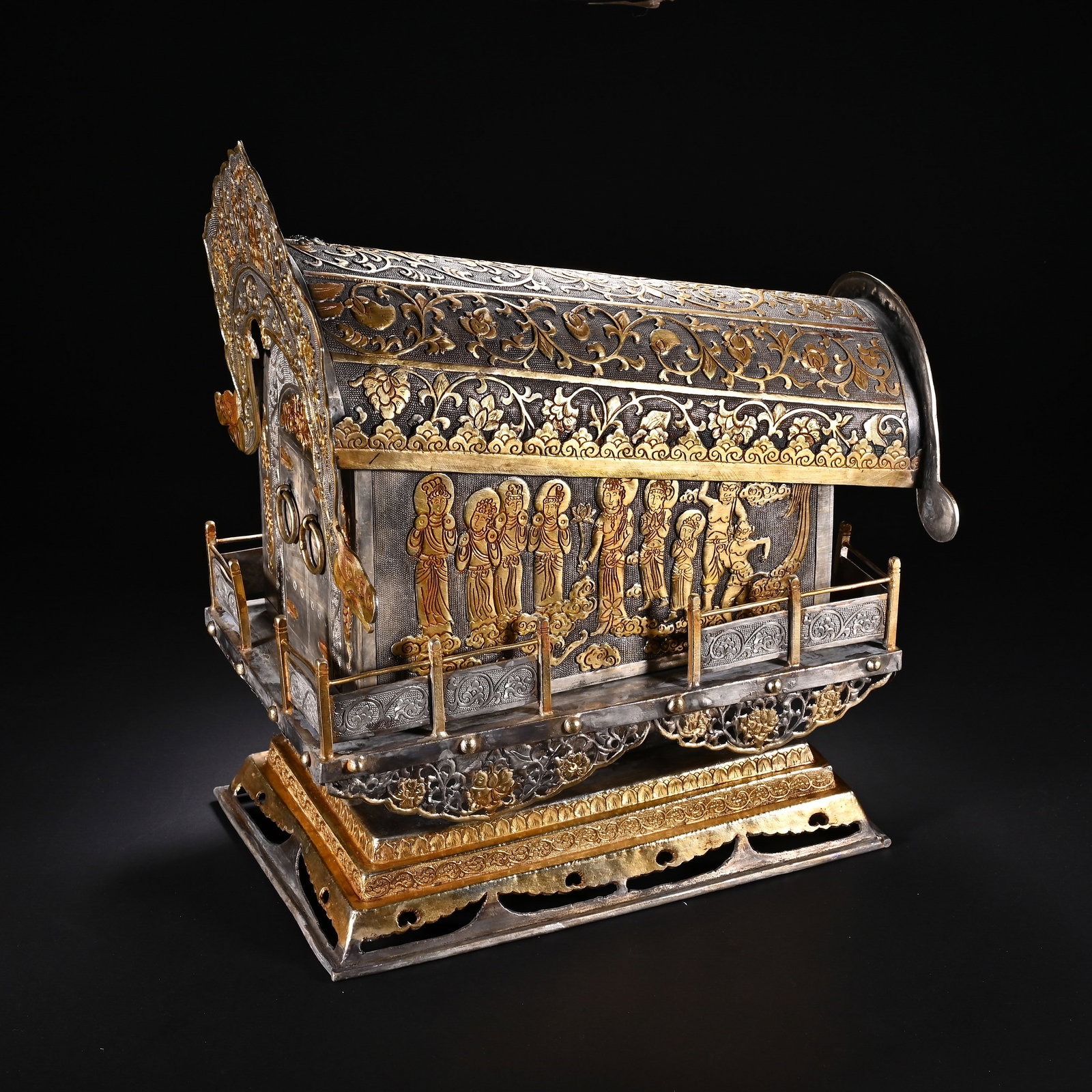 A Chinese Gilt-Bronze Reliquary Sarcophagus: A Chinese Gilt-Bronze Reliquary Sarcophagus This magnificent gilt-bronze reliquary sarcophagus, measuring 31 cm in height and 28 cm in width, is modeled after a miniature palanquin with intricate gold
