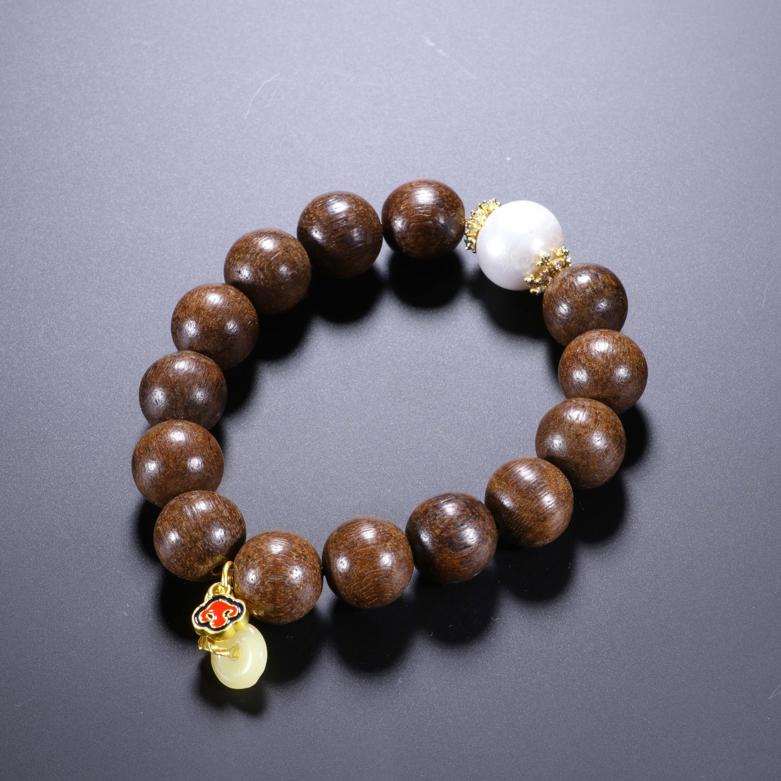 A Chinese Agarwood Beaded Bracelet with Jade and Pearl Accents (1 of 5)