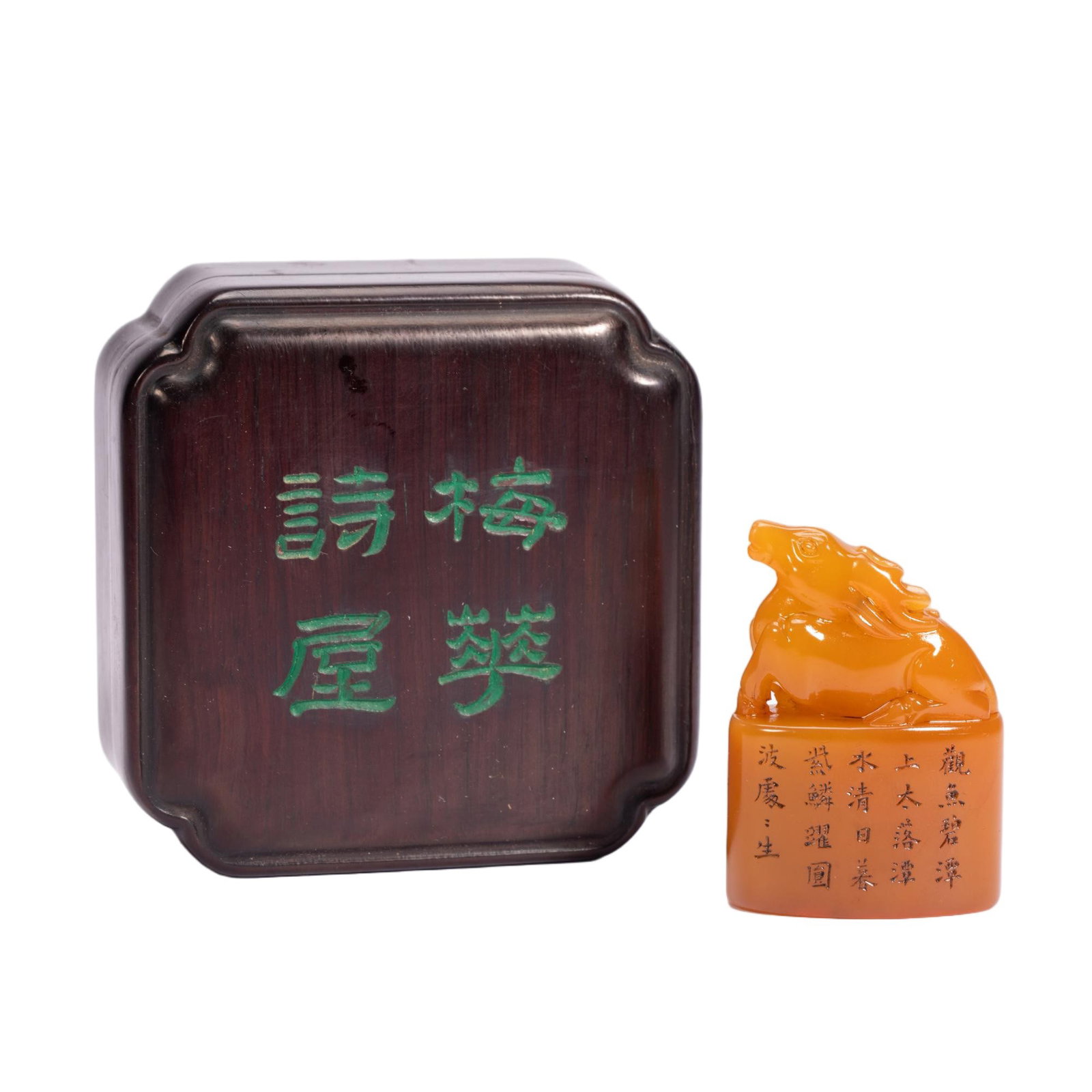 A CHINESE TIANHUANG STONE DEER SEAL: A CHINESE TIANHUANG STONE DEER SEAL This fine scholar's seal is carved from luminous golden Tianhuang soapstone, topped with a smoothly polished recumbent deer finial symbolizing longevity. The vertic