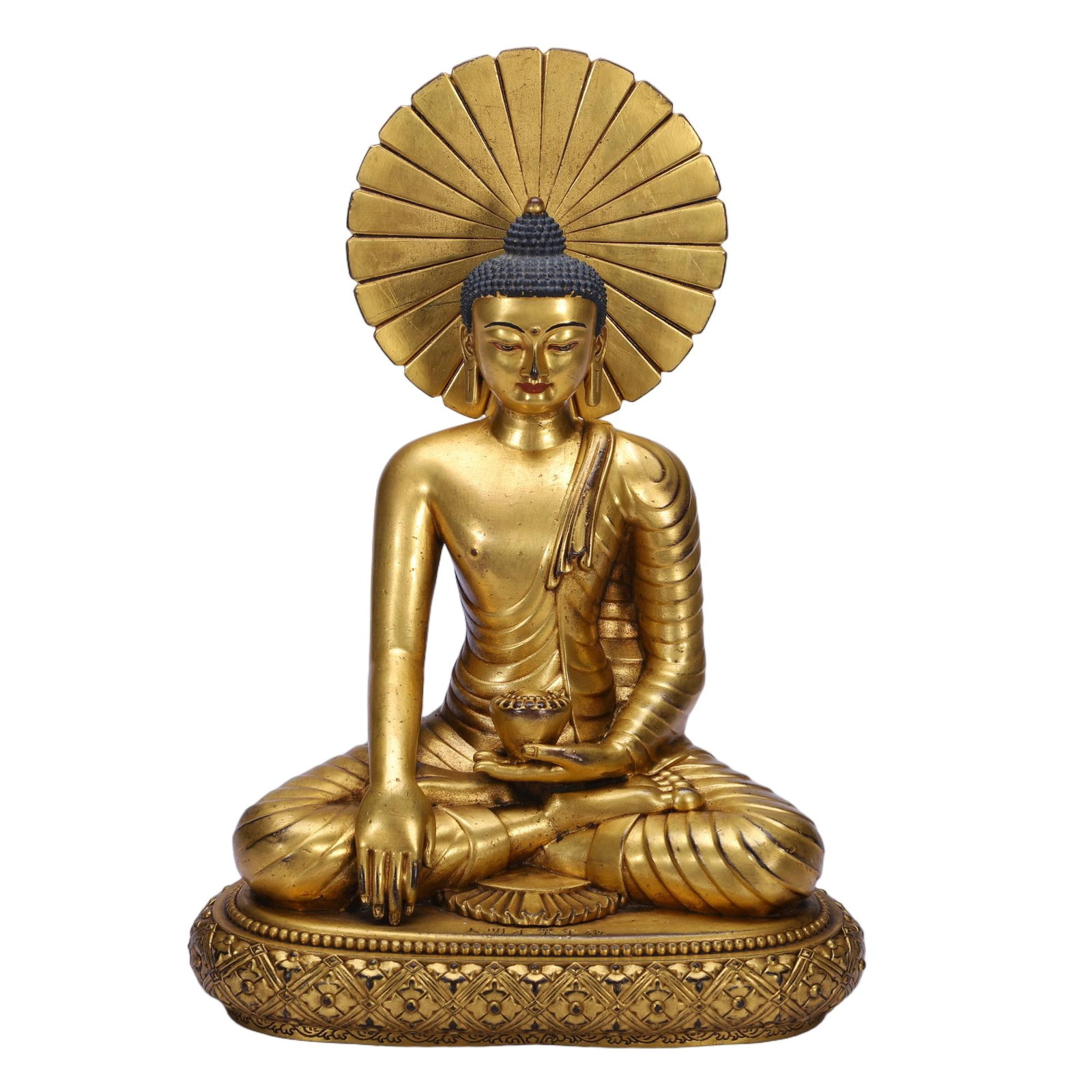 A CHINESE GILT BRONZE BUDDHA STATUE: A CHINESE GILT BRONZE BUDDHA STATUE This fully gilded copper Buddha sits in full lotus meditation atop an ornate oval base chased with geometric diamond patterns and beaded trim. Behind the ushnisha