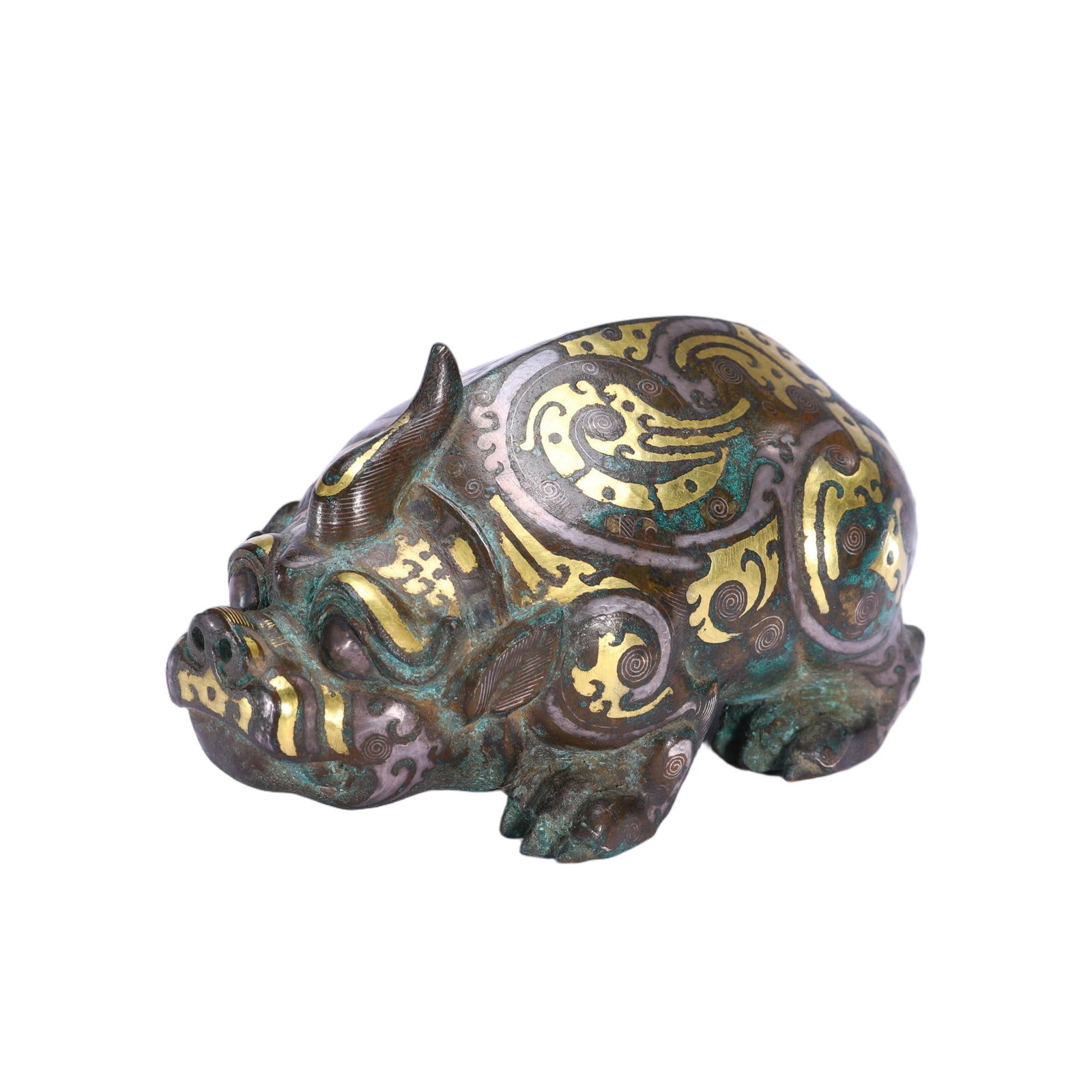 A CHINESE GOLD AND SILVER INLAID BRONZE MYTHICAL BEAST: A CHINESE GOLD AND SILVER INLAID BRONZE MYTHICAL BEAST Cast in recumbent pose, this archaistic bronze auspicious beast features a single spiralled horn, broad snout and stocky limbs with finely modell