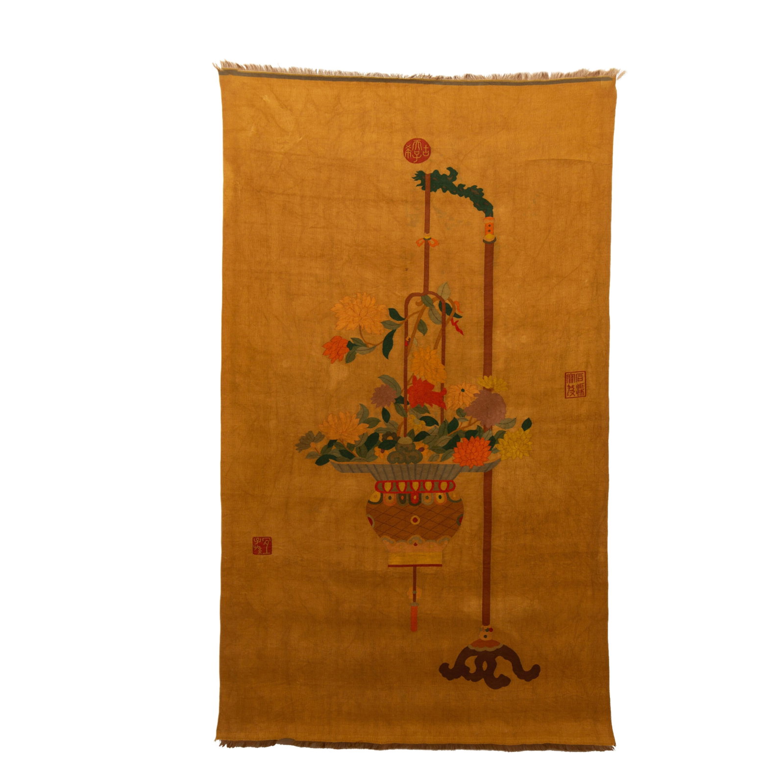 A CHINESE KESI AUSPICIOUS FLOWER PANEL: A CHINESE KESI AUSPICIOUS FLOWER PANEL This fine silk tapestry panel is woven in the intricate kesi cut-silk technique upon a warm mustard-yellow ground. The central motif depicts an elegant hanging f