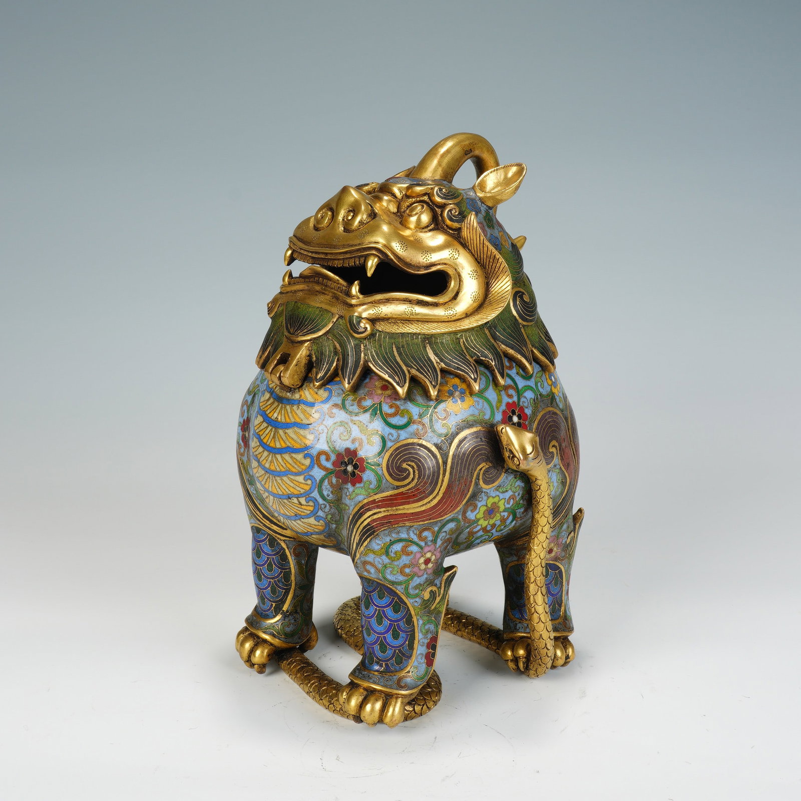 A CHINESE CLOISONNE LUDUAN INCENSE BURNER: A CHINESE CLOISONNE LUDUAN INCENSE BURNER This mythical beast-form cloisonne censer measures 17 cm wide, 14 cm deep and 25 cm tall, weighing 4260 grams total. Modelled as a luduan auspicious guardian 
