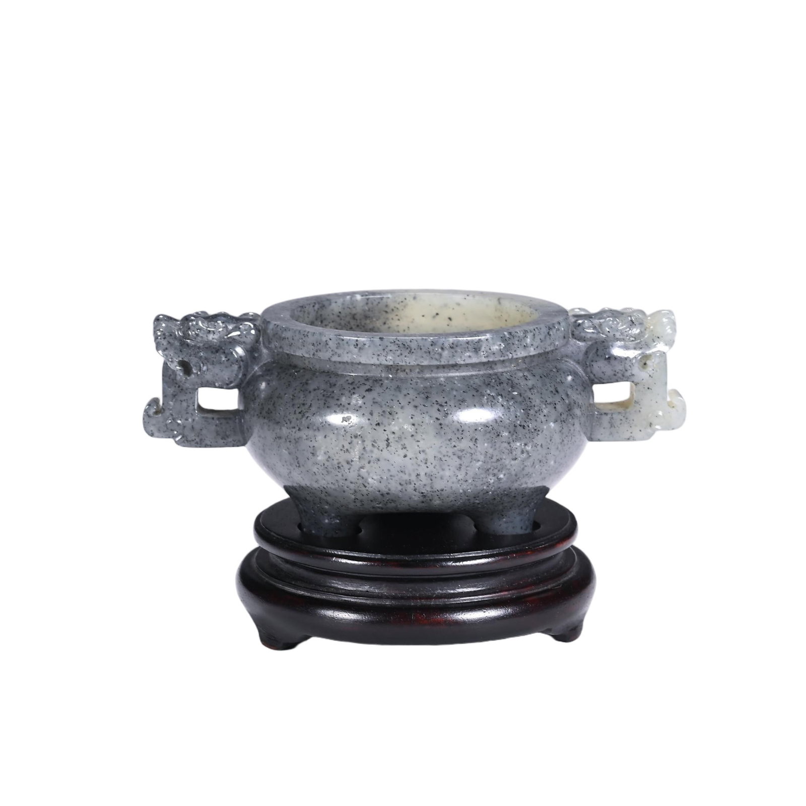 A CHINESE HETIAN JADE TRIPOD CENSER: A CHINESE HETIAN JADE TRIPOD CENSER Carved from speckled grey Hetian nephrite jade mottled with fine dark mineral flecks, this compact tripod censer follows the classic ding form. Its rounded bulbous 