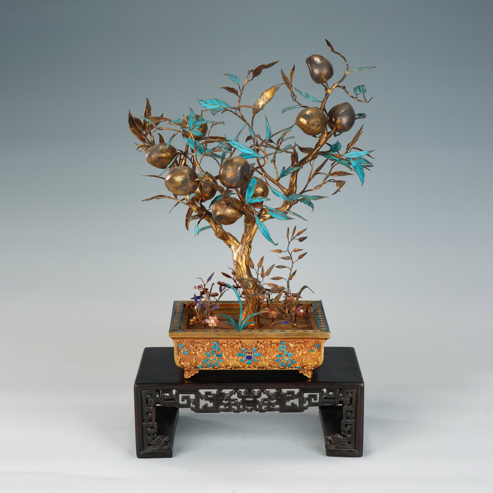 A CHINESE GILT SILVER GEM-INLAID PEACH BONSAI: A CHINESE GILT SILVER GEM-INLAID PEACH BONSAI This ornamental bonsai measures 26cm ? 19cm ? 33cm with an overall height of 41cm and weighs 1800 grams, crafted from solid silver gilded in rich gold ton
