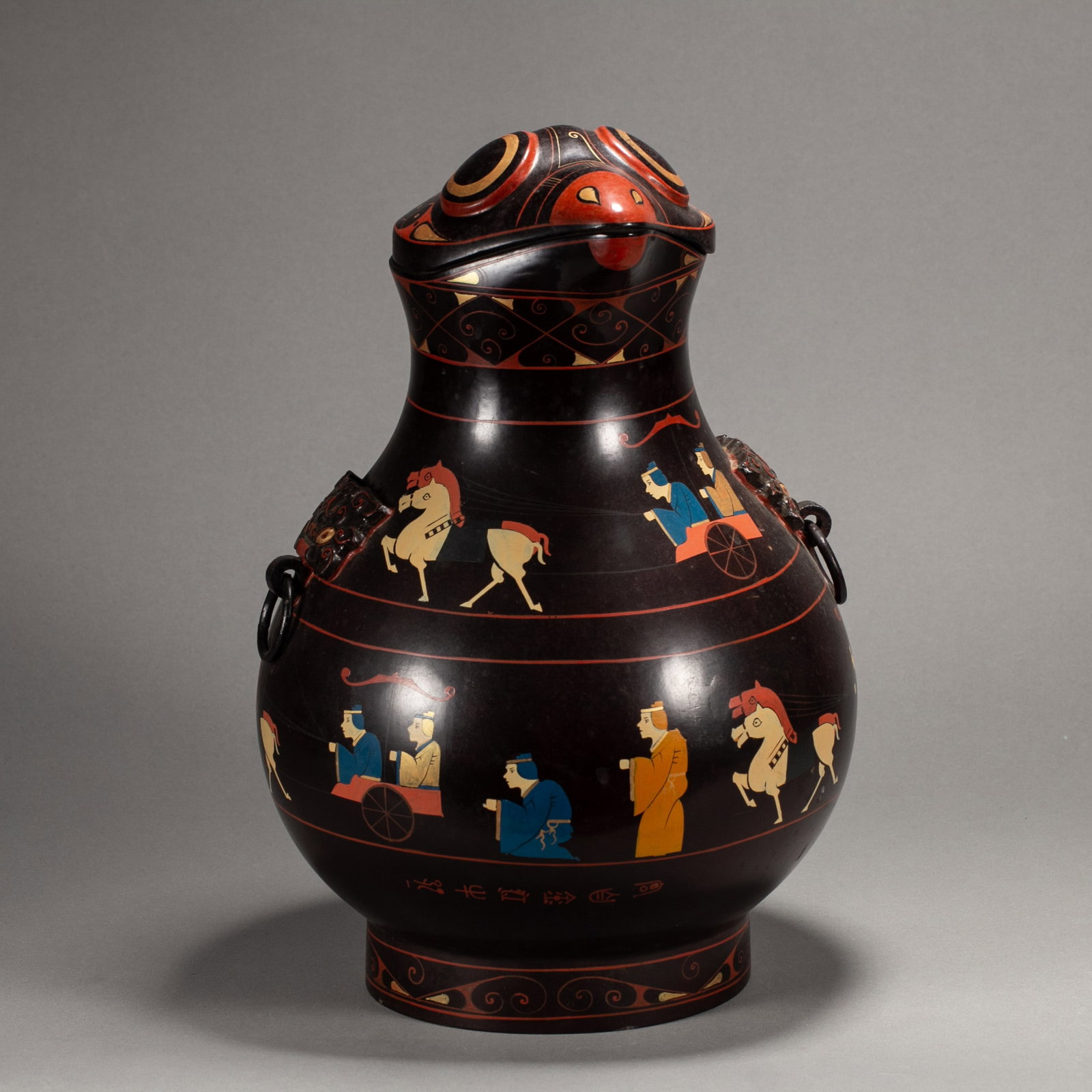 A CHINESE LACQUER ANIMAL ZUN VESSEL: A CHINESE LACQUER ANIMAL ZUN VESSEL This antique lacquer ritual vessel is modelled as a frog-headed beast zun with two mask ring handles flanking its bulbous body, raised on a short circular foot. Pol
