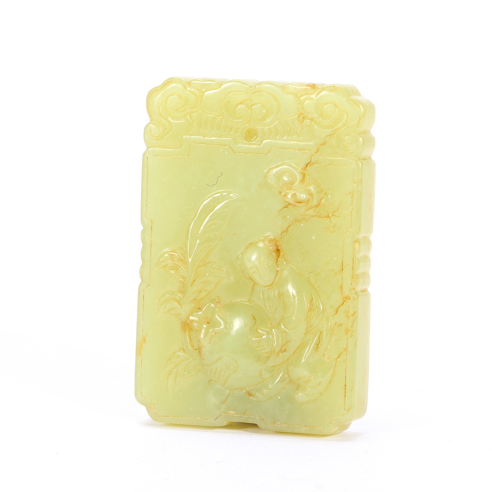 A CHINESE YELLOW JADE FIGURAL PLAQUE PENDANT: A CHINESE YELLOW JADE FIGURAL PLAQUE PENDANT This rectangular jade plaque is carved from soft pale yellow nephrite naturally veined with warm russet inclusions. The top edge is decorated with interloc