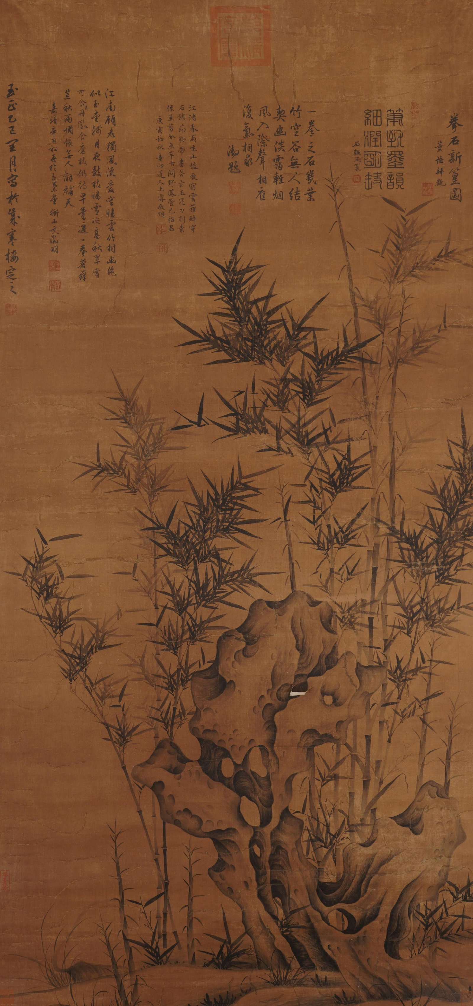 A CHINESE PAINTING OF BAMBOO AND ROCK, SIGNED WEN ZHENGMING: A CHINESE PAINTING OF BAMBOO AND ROCK, SIGNED WEN ZHENGMING Vertical ink painting on aged warm silk, inscribed, signed and sealed by Wen Zhengming, adorned with numerous imperial and collector seals p