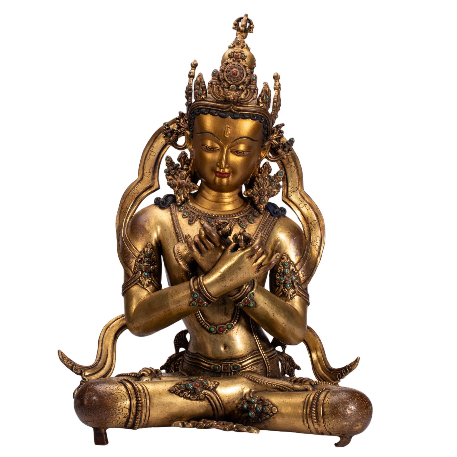 A CHINESE GILT BRONZE VAJRADHARA BUDDHA: A CHINESE GILT BRONZE VAJRADHARA BUDDHA This substantial fully gilded copper sculpture portrays Vajradhara seated in full lotus meditation pose with hands crossed at the chest holding a vajra and bell