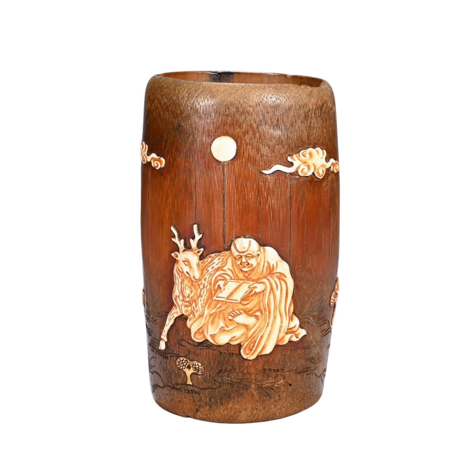 A CHINESE BAMBOO BRUSH POT INLAID WITH SHOUSHAN STONE: A CHINESE BAMBOO BRUSH POT INLAID WITH SHOUSHAN STONE Crafted from aged bamboo with a warm honeyed patina, this cylindrical scholar's brush pot features elaborate relief inlay of pale Shoushan soapsto