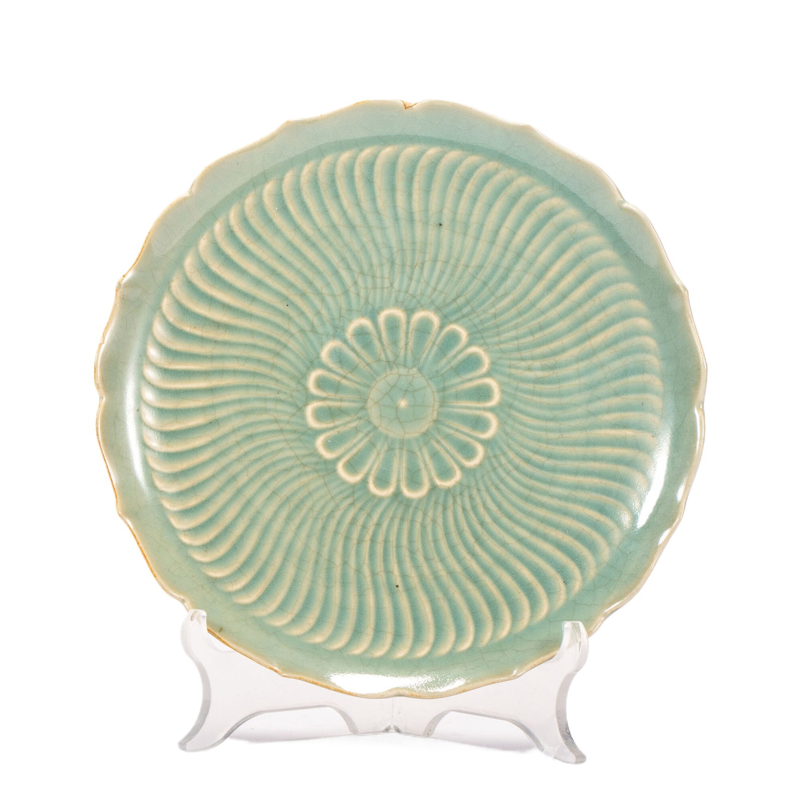 A CHINESE RU-TYPE CELADON FLORAL LOBED PLATE: A CHINESE RU-TYPE CELADON FLORAL LOBED PLATE This elegant lobed ceramic plate boasts a soft sky-celadon glaze suffused with fine natural crackle throughout the surface. The interior is moulded with a 
