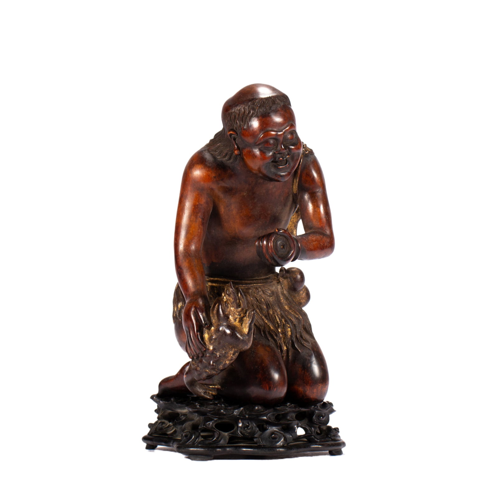 A CHINESE BOXWOOD LIU HAI & GOLDEN TOAD CARVING: A CHINESE BOXWOOD LIU HAI & GOLDEN TOAD CARVING This lifelike figure is hand-carved from dense boxwood with a rich warm polished patina. The immortal Liu Hai kneels cheerfully, holding a coin string i