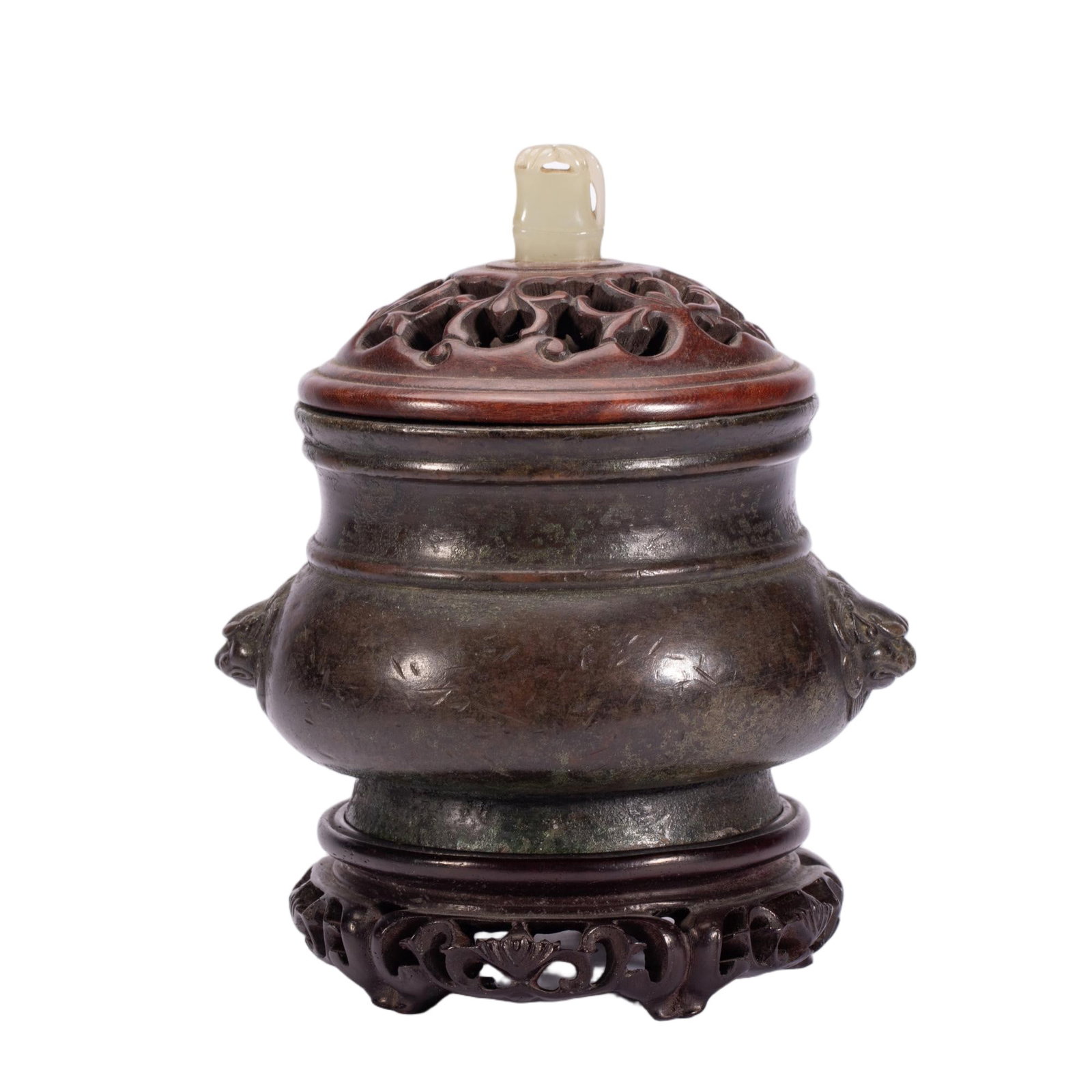 A CHINESE BRONZE LION-HANDLED CENSER: A CHINESE BRONZE LION-HANDLED CENSER This bronze incense burner features a compressed bulbous midsection flanked by a pair of finely moulded lion mask handles. Two raised horizontal moulded bands