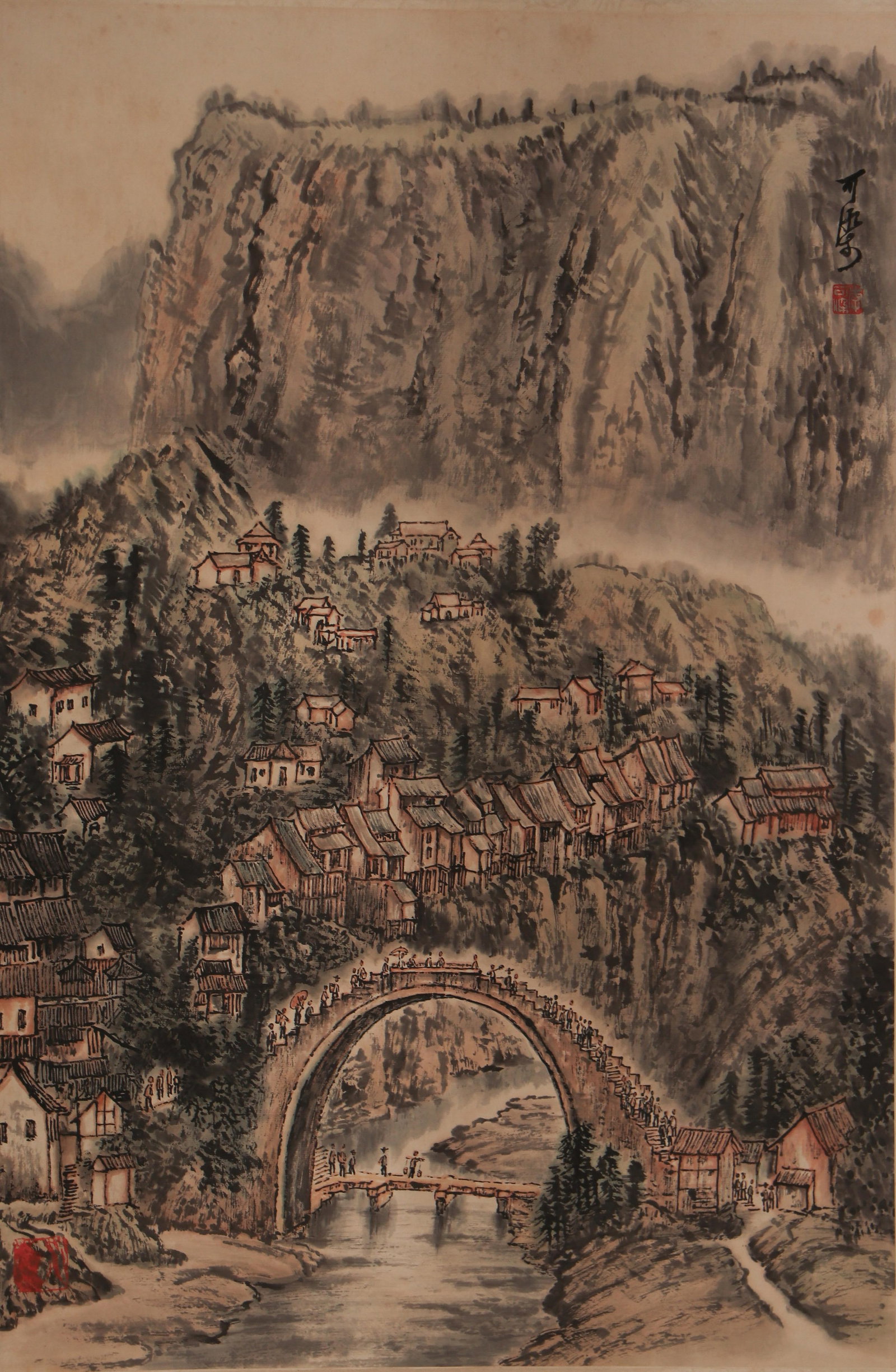 A CHINESE PAINTING OF MOUNTAIN VILLAGE, SIGNED LI KERAN: A CHINESE PAINTING OF MOUNTAIN VILLAGE, SIGNED LI KERAN Vertical ink and light colour landscape painting signed and sealed by Li Keran at the upper right. A grand sheer cliff looms over a layered moun