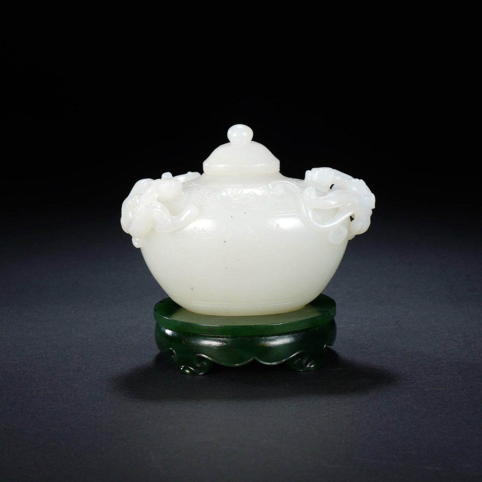 A CHINESE WHITE JADE CENSER WITH CHILONG: A CHINESE WHITE JADE CENSER WITH CHILONG This single lidded white jade censer measures 8 cm wide, 5 cm deep and stands 7.8 cm in total height, weighing 203 grams. The smooth, creamy white jade body is