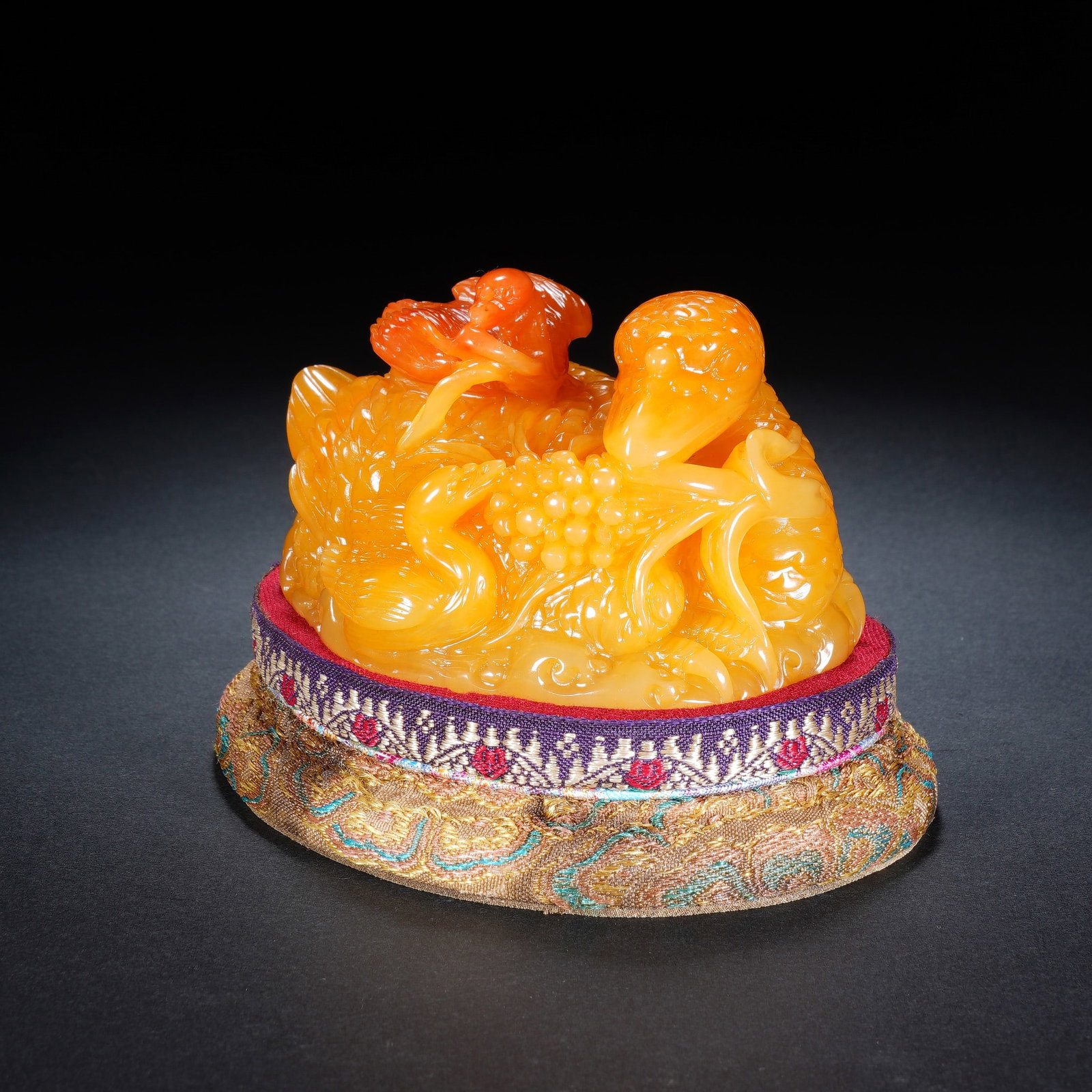 A CHINESE TIANHUANG STONE MANDARIN DUCK ORNAMENT: A CHINESE TIANHUANG STONE MANDARIN DUCK ORNAMENT This finely carved Tianhuang stone ornament measures 10.5 cm long, 7 cm wide with an overall height of 9 cm, weighing 481 grams. Rendered in rich warm 
