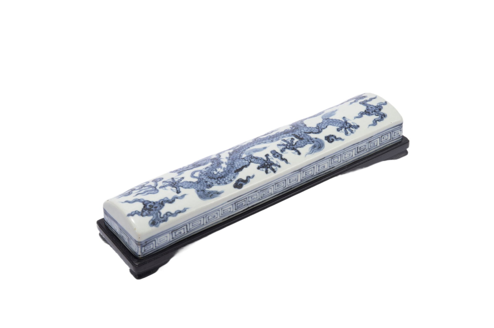 A BLUE AND WHITE PORCELAIN PAPER WEIGHT: A BLUE AND WHITE PORCELAIN PAPER WEIGHT Of rectangular shape, decorated with five-claws dragon atop, key fret band circling the sides. DIMENSIONS: L. 26 cm. W. 5.2 cm. H. 3.5 cm. HAVE A SIMILAR ITEM T