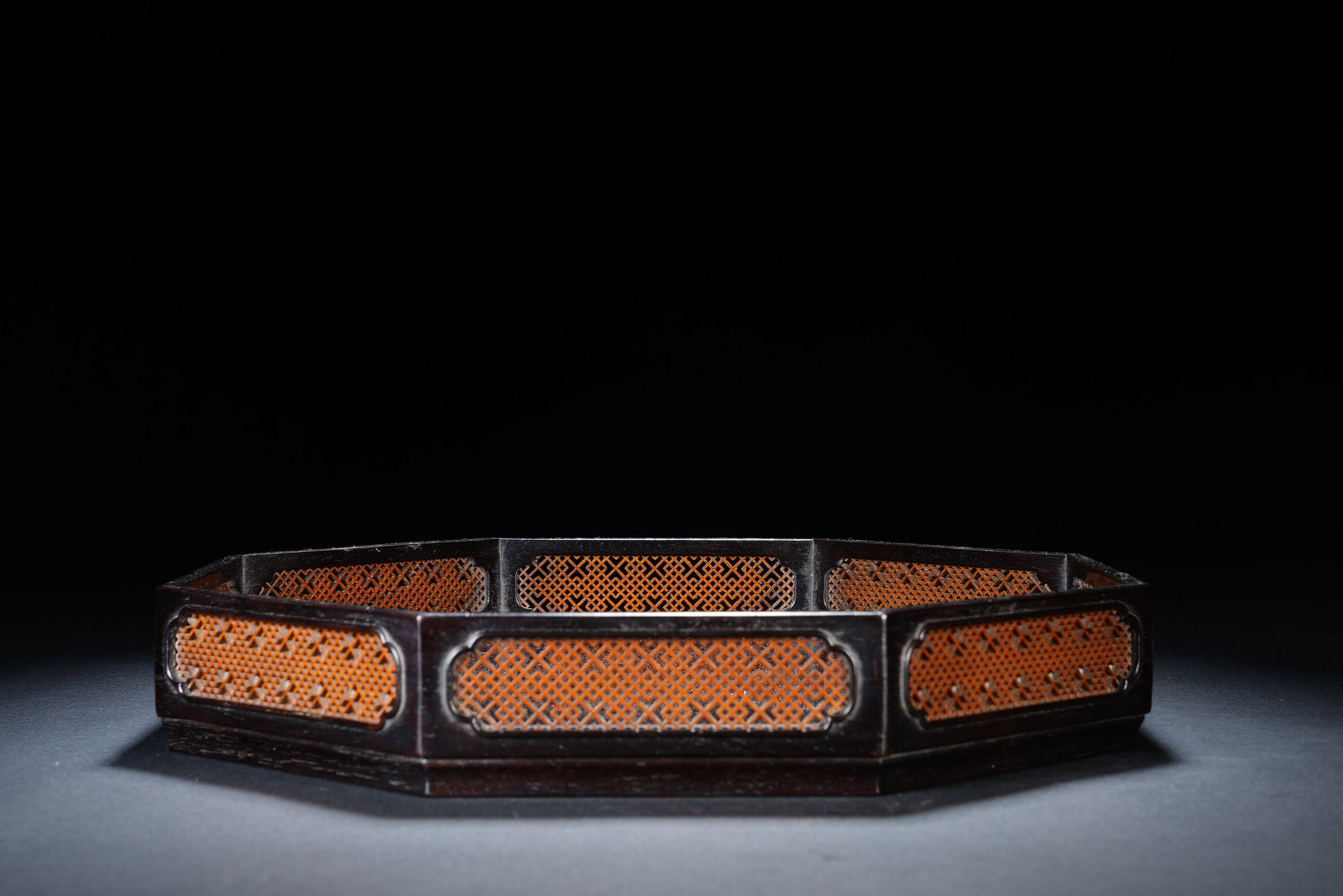 A CHINESE ZITAN OCTAGONAL BAMBOO INLAID TRAY: A CHINESE ZITAN OCTAGONAL BAMBOO INLAID TRAY Crafted from dense polished zitan hardwood, this octagonal scholar's tray features multiple recessed cartouche panels inset with finely woven light bamboo 
