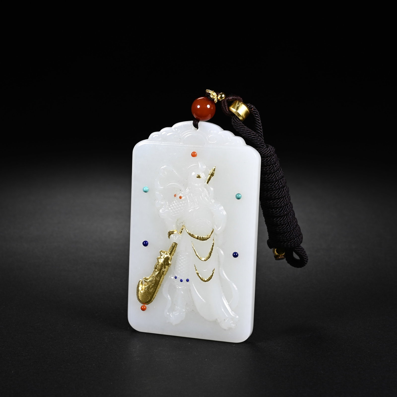 A CHINESE WHITE HETIAN JADE GUAN GONG PLAQUE WITH GOLD INLAY: A CHINESE WHITE HETIAN JADE GUAN GONG PLAQUE WITH GOLD INLAY This rectangular pendant is crafted from smooth milky white Hetian nephrite, measuring 7.5cm tall, 4.5cm wide and 0.9cm thick. The top is c