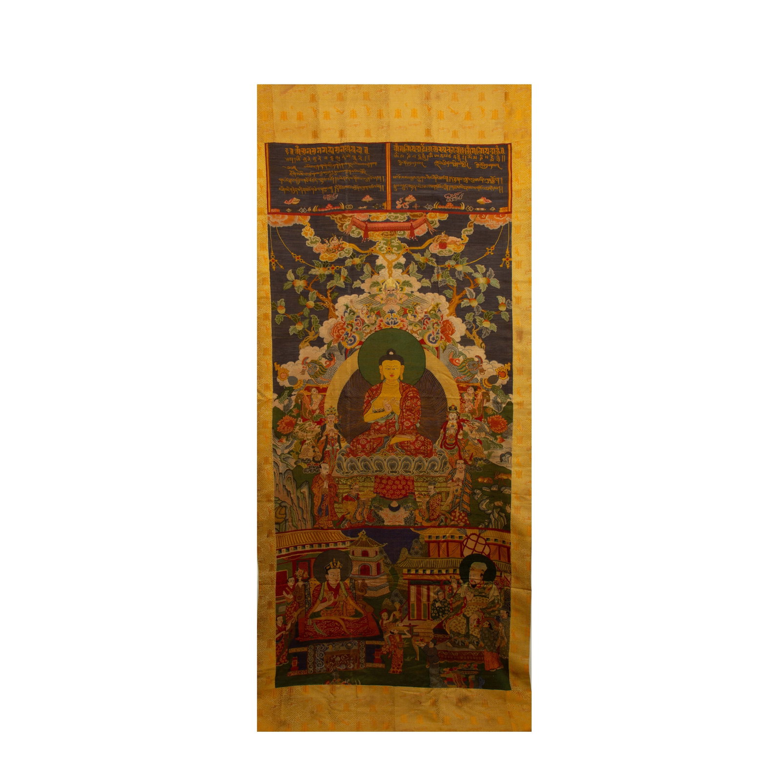 A CHINESE NASHA EMBROIDERED BUDDHA THANGKA: A CHINESE NASHA EMBROIDERED BUDDHA THANGKA This monumental vertical thangka is crafted with fine Nasha embroidery upon deep silk ground, centred on a seated Buddha framed by elaborate blooming floral 