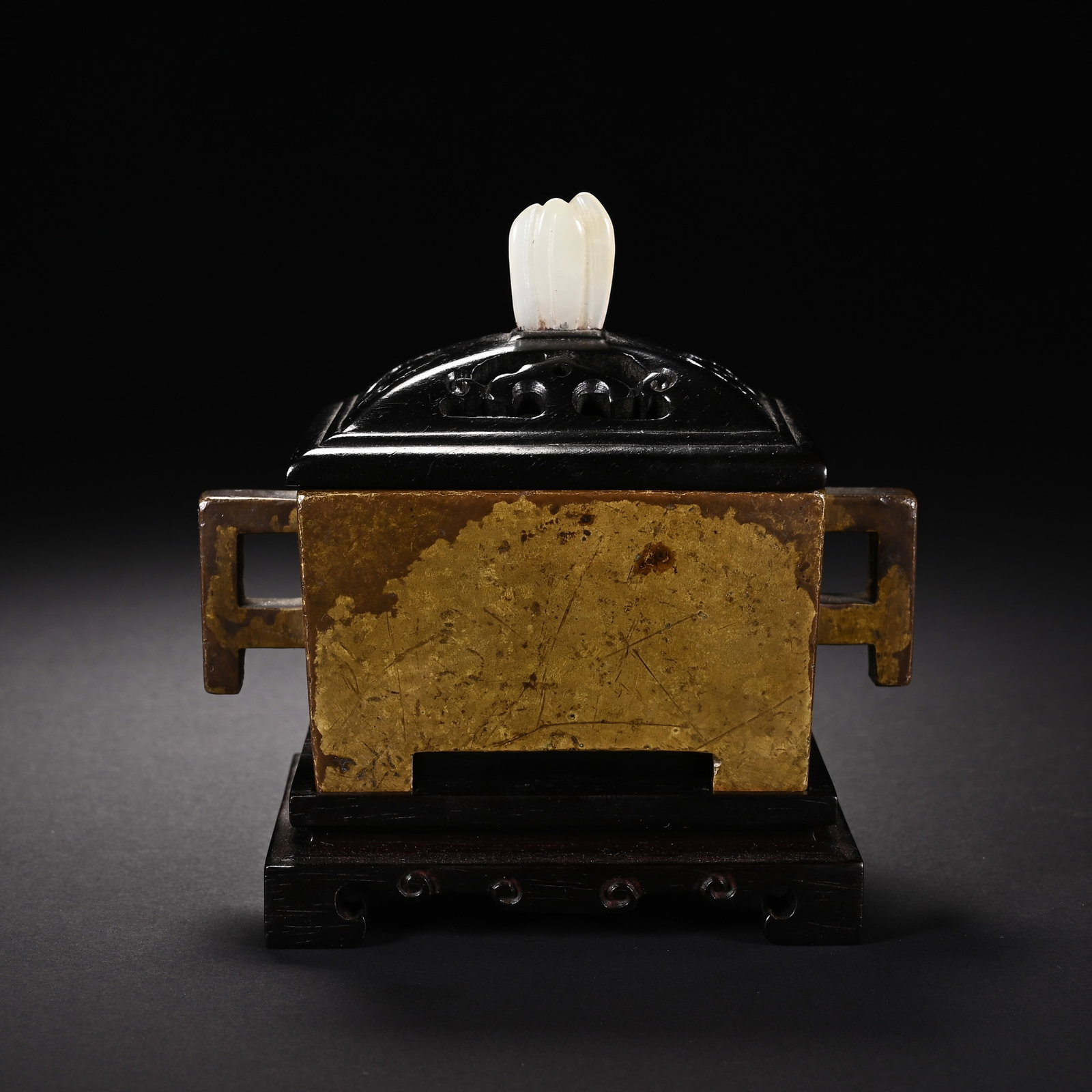 A CHINESE RECTANGULAR BRONZE CENSER WITH TWIN SQUARE HANDLES: A CHINESE RECTANGULAR BRONZE CENSER WITH TWIN SQUARE HANDLES This rectangular bronze censer features two hollow rectangular side handles and bears rich aged golden patina with fine natural crackle tex