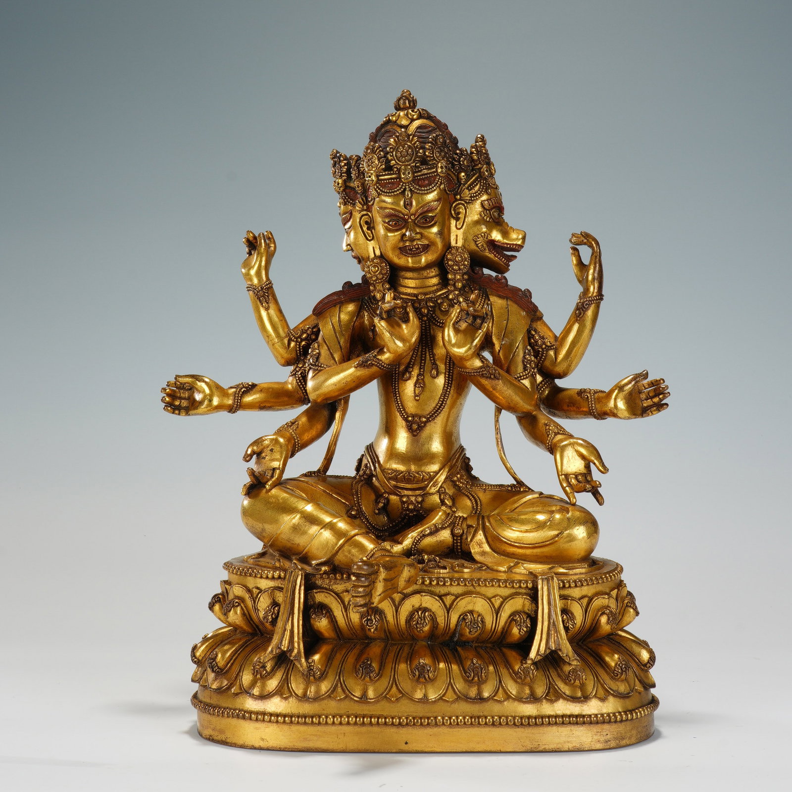 A CHINESE GILT BRONZE EIGHT-ARM DHARMA KING SEATED FIGURE (1 of 10)