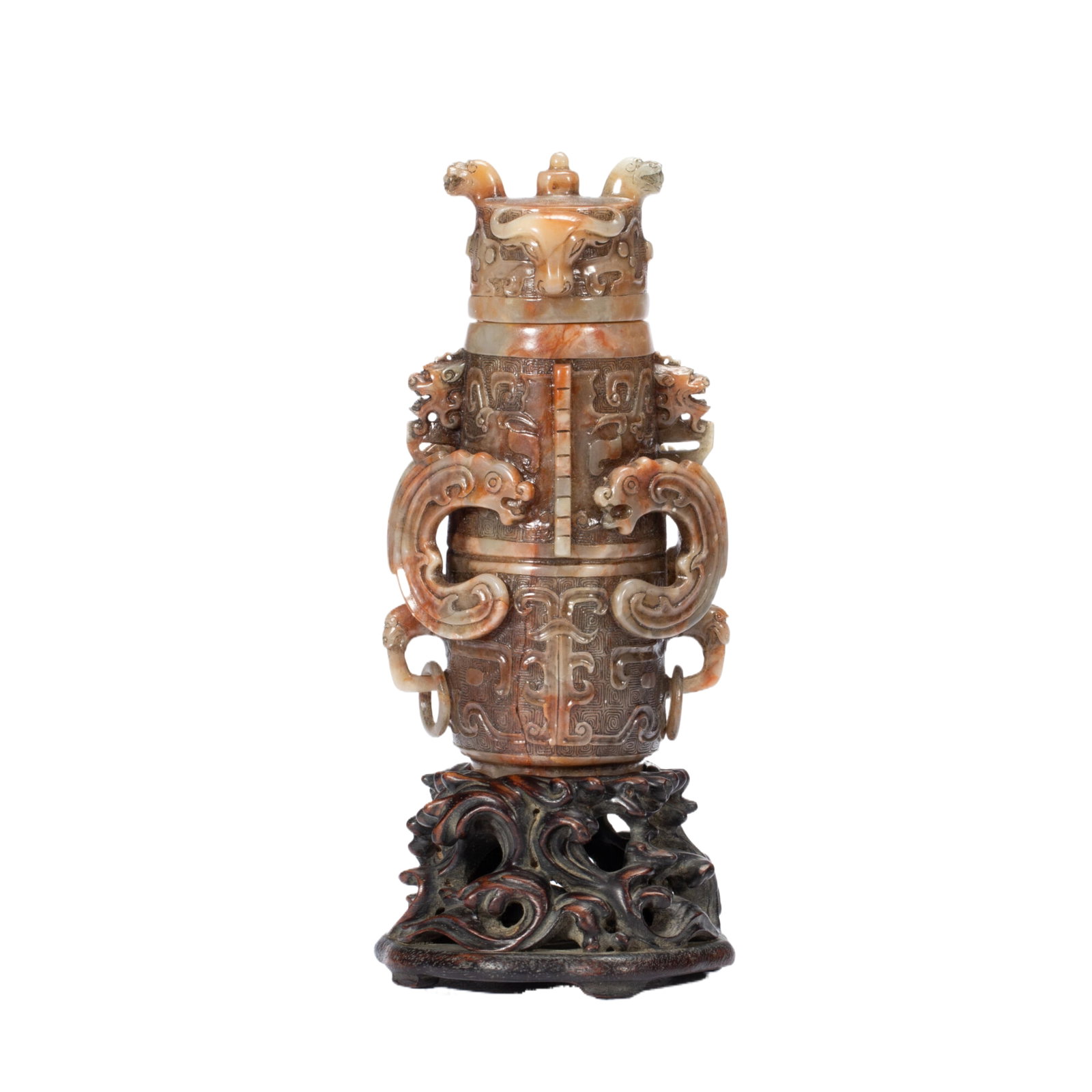 A CHINESE SHOUSHAN STONE ARCHAISTIC VASE: A CHINESE SHOUSHAN STONE ARCHAISTIC VASE A finely carved covered vase sculpted from natural Shoushan stone with variegated warm ochre and grey mottled tones. The vessel is modelled after ancient bronz