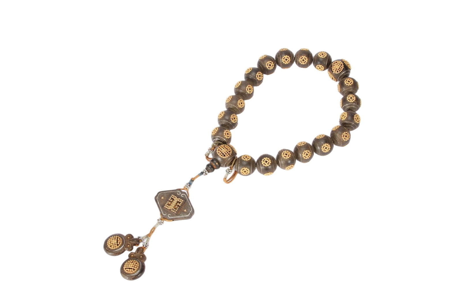 A CHINESE AGARWOOD GOLD INLAID PRAYER WORRY BEADS: A CHINESE AGARWOOD GOLD INLAID PRAYER WORRY BEADS This complete hand-held mala strand is crafted from natural agarwood barrel beads, each meticulously inlaid with golden openwork longevity and coin mo