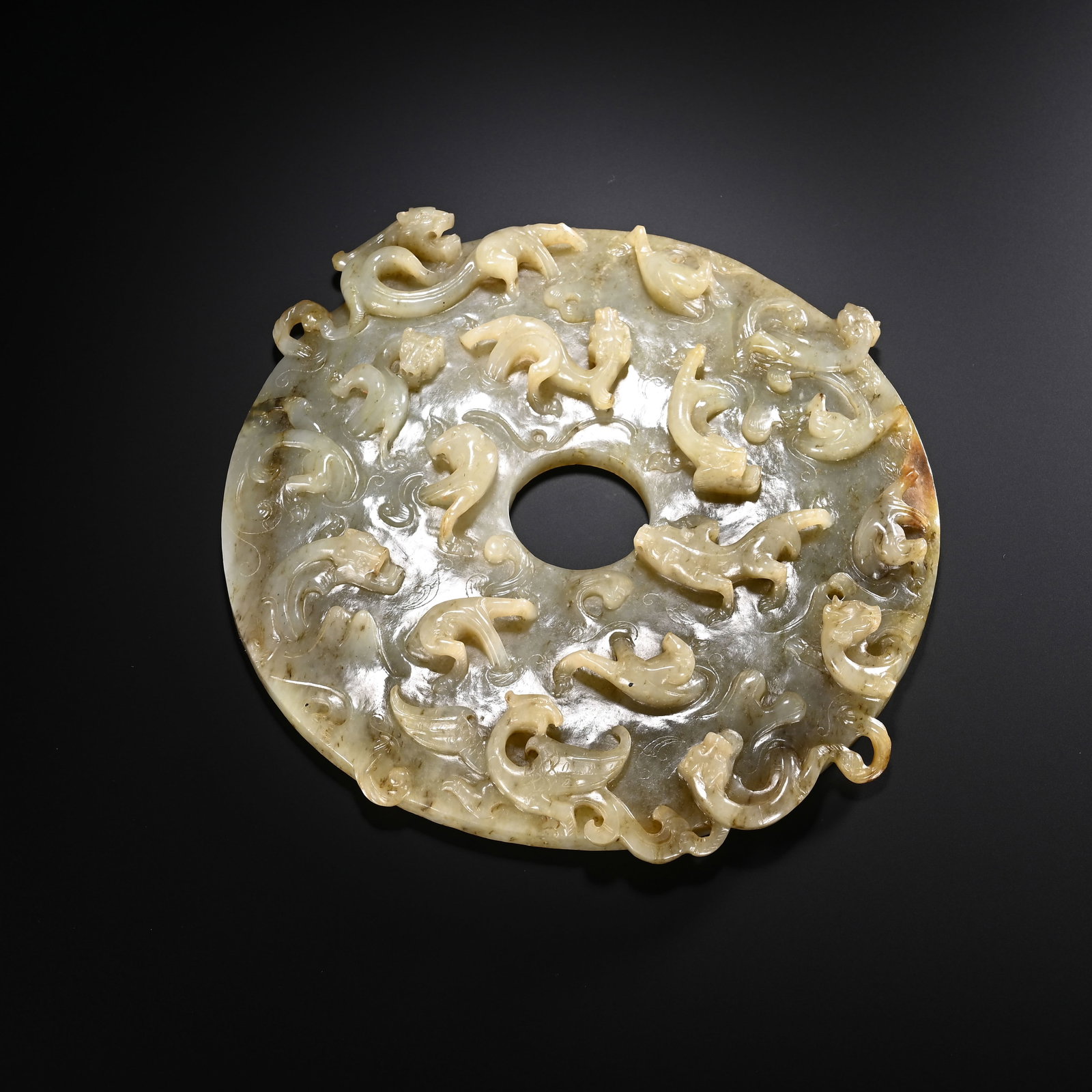 A CHINESE JADE BI DISC WITH RELIEF CHILONG DRAGONS (1 of 9)