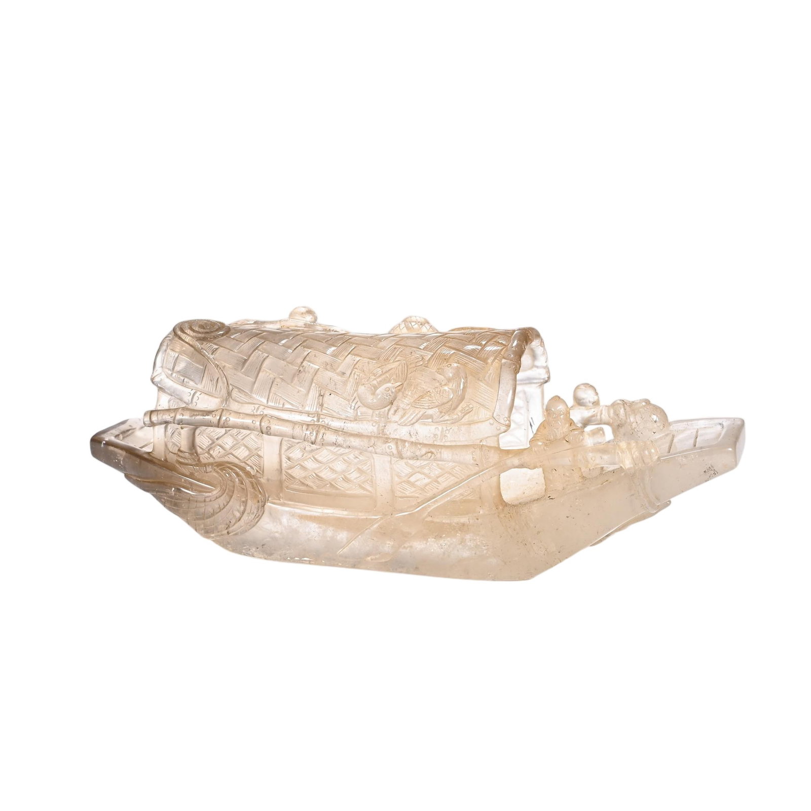 A CHINESE ROCK CRYSTAL BOAT ORNAMENT: A CHINESE ROCK CRYSTAL BOAT ORNAMENT This intricate miniature vessel is entirely hand-carved from translucent pale rock crystal, reproducing a traditional Chinese river barge in meticulous detail. The