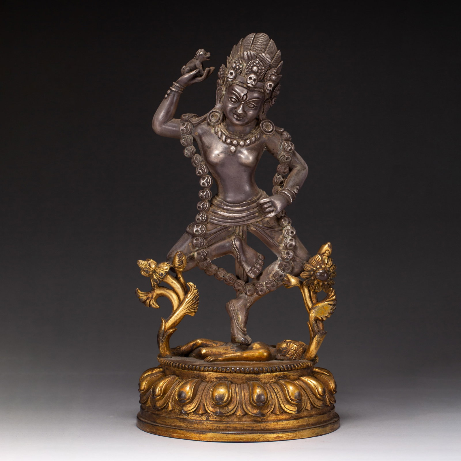 A CHINESE PARTIALLY GILT SILVERED BRONZE DAKINI FIGURE (1 of 10)