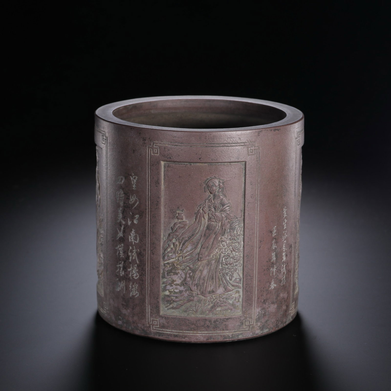 A CHINESE YIXING ZISHA BRUSH POT CARVED WITH FOUR GREAT BEAUTIES: A CHINESE YIXING ZISHA BRUSH POT CARVED WITH FOUR GREAT BEAUTIES This cylindrical scholar's brush holder measures 11.5cm in height and width, weighing 574.5 grams, crafted from classic purple zisha cl