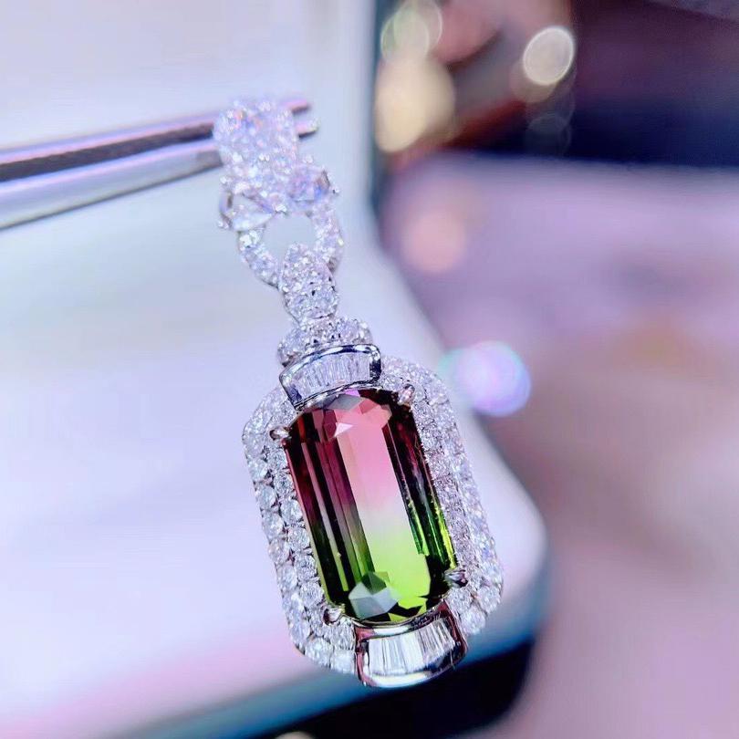 14K White Gold 5.15 CT Tourmaline & Diamond Pendant: Ref:202263483 Gold Content:14K White Gold For people:Women Main Stone:Tourmaline Number of stones:1 Shape:Irregular Carat Total Wt:5.15ct Color:Color Cut Grade:G Adjacent Gemstone 2 : Diamond