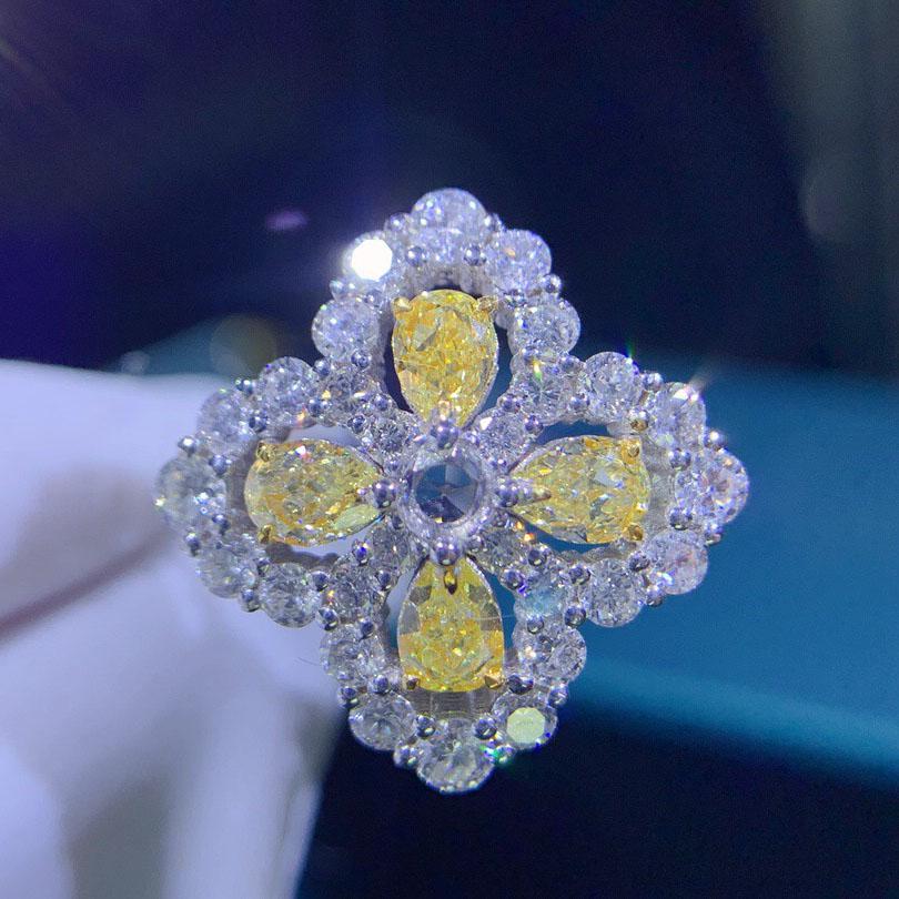 14K White Gold 0.98 CT Yellow Diamond Ring: Ref:2022710776 Gold Content:14K White Gold For people:Women Ring Size:7.25US Main Stone:Diamond Number of stones:4 Shape:Pear Carat Total Wt:0.98ct Clarity Grade:VS2 Color:Yellow Cut Grade:G