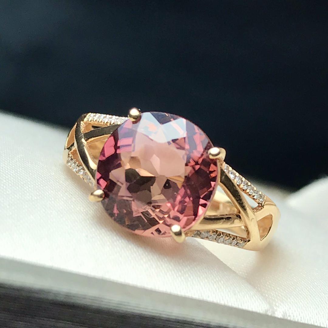 14K Rose Gold 2.92 CT Tourmaline & Diamond Ring: Ref:2022928402 Gold Content:14K Rose Gold For people:Women Total Item Weight :2.61grams Ring Size:7.25us Main Stone:Tourmaline Number of stones:1 Shape:Round Carat Total Wt:2.92ct Color:Red Cut Grade
