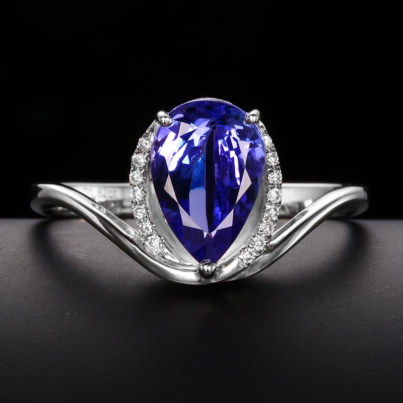 14K White Gold 1.67 CTW Tanzanite & Diamond Ring: Ref:1017174 Gold Content:14K White Gold For people:Women Ring Size:7.25US Main Stone:Tanzanite Number of stones:1 Shape:Pear Carat Total Wt:1.62ct Color:Blue Cut Grade:G Adjacent Gemstone 2 :
