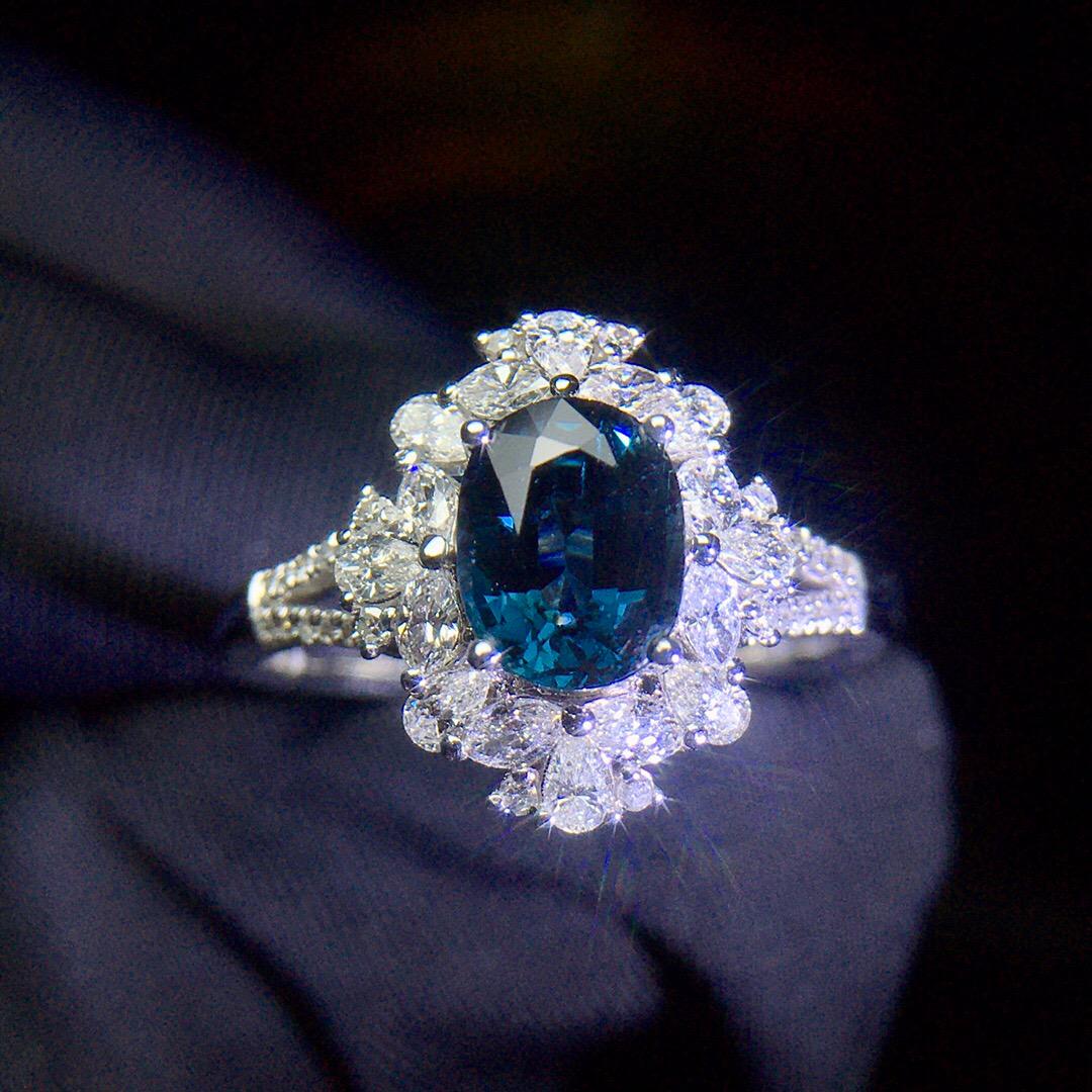 14K White Gold 1.905 CTW Sapphire & Diamond Ring: Ref:1209201 Gold Content:14K White Gold For people:Women Total Item Weight:3.38grams Ring Size:7.25US Main Stone:Sapphire Number of stones:1 Shape:Oval Carat Total Wt:1.3ct Color:Blue Cut Grade:G