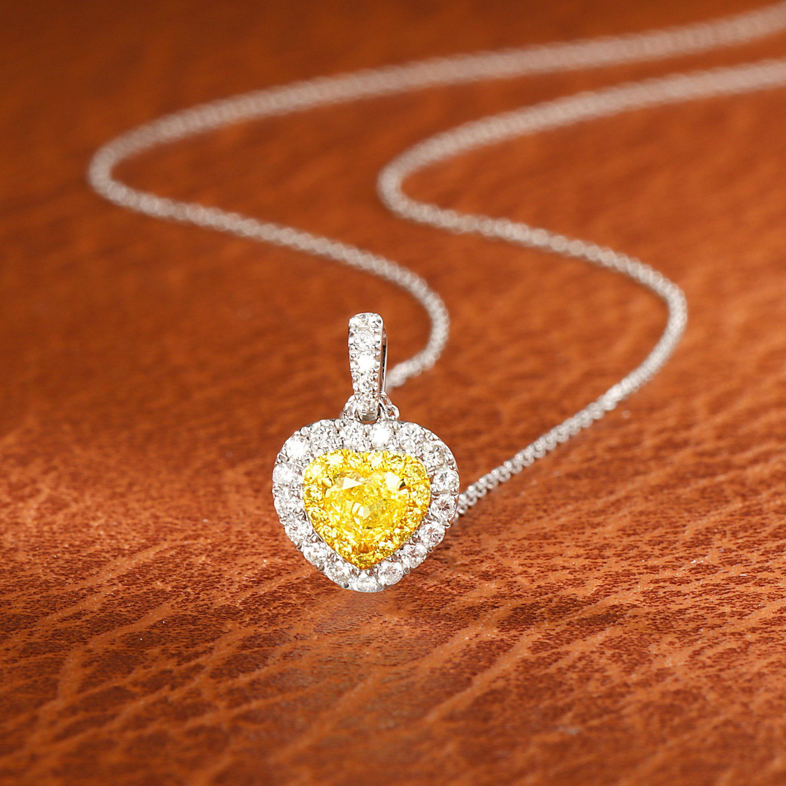 14K WHITE GOLD 0.45 CTW YELLOW DIAMOND & DIAMOND NECKLACE: Ref:23225117 Gold Content:14K White Gold Main Gemstone:Yellow Diamond Number of stones:1 Shape:Heart Carat Weight:0.23ct Color:Yellow Cut Grade:G Adjacent Gemstone 2 : Diamond Shape:Round Cara