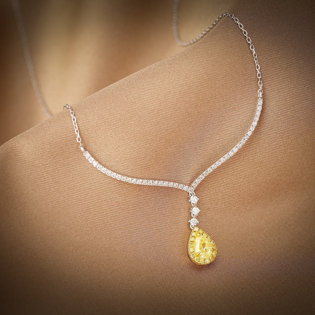 CERTIFIED 14K GOLD 0.75 CTW NATURAL YELLOW DIAMOND & DIAMOND NECKLACE: Ref:230608170 Gold Content:14K Gold Main Gemstone:Yellow Diamond Number of stones:1 Shape:Pear Carat Weight:0.41ct Color:Yellow Treatment:Natural Cut Grade:G Adjacent Gemstone 2 : Diamond Shap