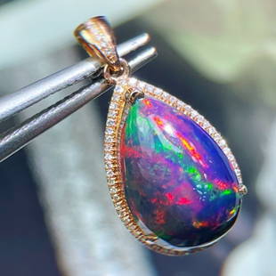 14K GOLD 4.9 CT NATURAL OPAL & DIAMOND PENDANT: Ref:230650389 Gold Content:14K Gold Main Gemstone:Opal Number of stones:1 Shape:Pear Carat Weight:4.9ct Color:Color Treatment:Natural Cut Grade:G Adjacent Gemstone 2 : Diamond Shape:Round