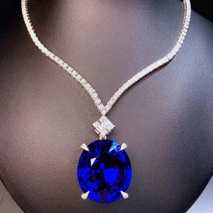 14K GOLD 57.08 CTW VIVID BLUE NATURAL TANZANITE & DIAMOND NECKLACE: Ref:230649095Gold Content:14K GoldMain Gemstone:TanzaniteNumber of stones:1Shape:OvalCarat Weight:52.55ct Color:Vivid BlueTreatment:NaturalCut Grade:GAdjacent Gemstone 2 : DiamondShape:RoundCarat